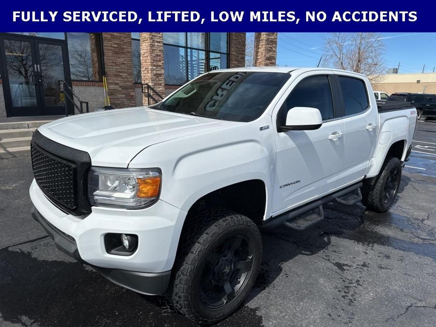 2015 Summit White /Black GMC Canyon SLE1 (1GTG6BE3XF1) with an 3.6L V6 DGI DOHC VVT engine, Automatic transmission, located at 8595 Washington St., Thornton, CO, 80229, (303) 287-5511, 39.852348, -104.978447 - 2015 GMC Canyon Clean Carfax, No Accident, Non Smoker, Non Pet Truck, Backup Camera, Leather, Power Seats, LIFTED and hard tonneau cover with locks.Canyon SLE1, 3.6L V6 DGI DOHC VVT, 4WD.<br><br> D1 Auto NEVER charges dealer fees! All cars have clean titles and have been inspected for mechanical iss - Photo#1