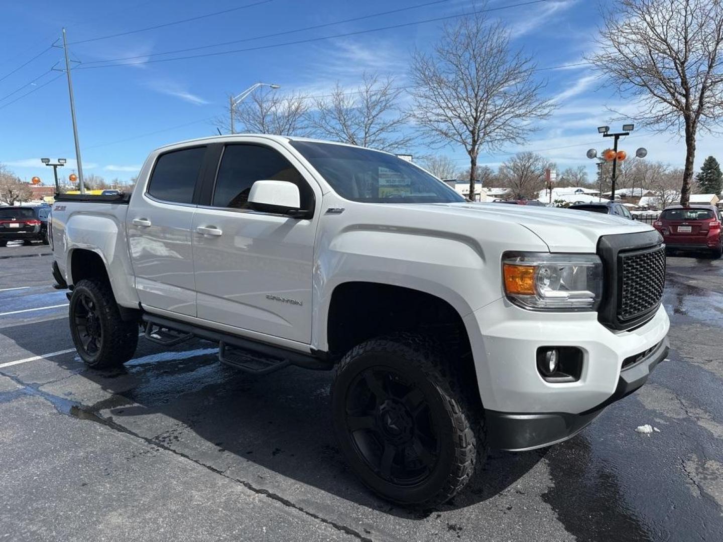 2015 Summit White /Black GMC Canyon SLE1 (1GTG6BE3XF1) with an 3.6L V6 DGI DOHC VVT engine, Automatic transmission, located at 8595 Washington St., Thornton, CO, 80229, (303) 287-5511, 39.852348, -104.978447 - 2015 GMC Canyon Clean Carfax, No Accident, Non Smoker, Non Pet Truck, Backup Camera, Leather, Power Seats, LIFTED and hard tonneau cover with locks.Canyon SLE1, 3.6L V6 DGI DOHC VVT, 4WD.<br><br> D1 Auto NEVER charges dealer fees! All cars have clean titles and have been inspected for mechanical iss - Photo#3