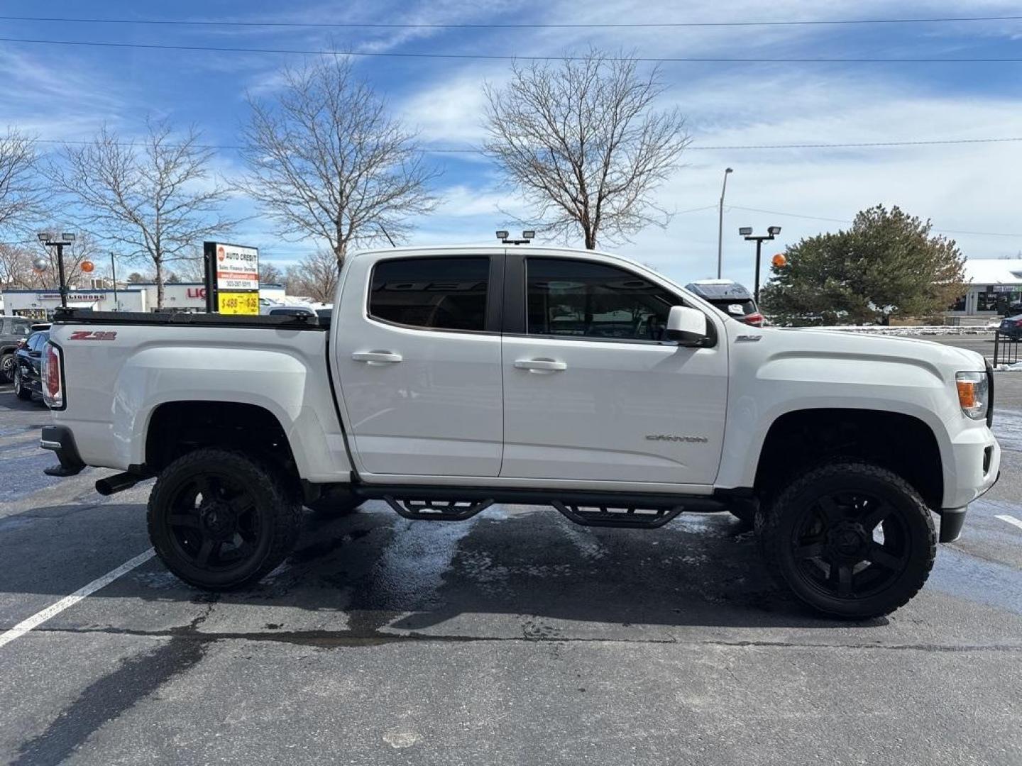 2015 Summit White /Black GMC Canyon SLE1 (1GTG6BE3XF1) with an 3.6L V6 DGI DOHC VVT engine, Automatic transmission, located at 8595 Washington St., Thornton, CO, 80229, (303) 287-5511, 39.852348, -104.978447 - 2015 GMC Canyon Clean Carfax, No Accident, Non Smoker, Non Pet Truck, Backup Camera, Leather, Power Seats, LIFTED and hard tonneau cover with locks.Canyon SLE1, 3.6L V6 DGI DOHC VVT, 4WD.<br><br> D1 Auto NEVER charges dealer fees! All cars have clean titles and have been inspected for mechanical iss - Photo#4