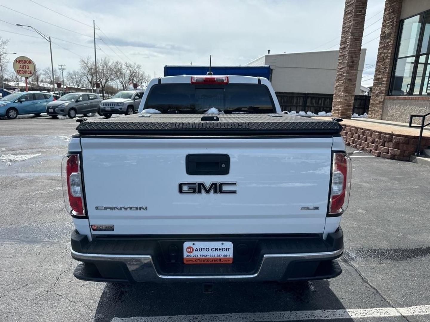 2015 Summit White /Black GMC Canyon SLE1 (1GTG6BE3XF1) with an 3.6L V6 DGI DOHC VVT engine, Automatic transmission, located at 8595 Washington St., Thornton, CO, 80229, (303) 287-5511, 39.852348, -104.978447 - 2015 GMC Canyon Clean Carfax, No Accident, Non Smoker, Non Pet Truck, Backup Camera, Leather, Power Seats, LIFTED and hard tonneau cover with locks.Canyon SLE1, 3.6L V6 DGI DOHC VVT, 4WD.<br><br> D1 Auto NEVER charges dealer fees! All cars have clean titles and have been inspected for mechanical iss - Photo#6