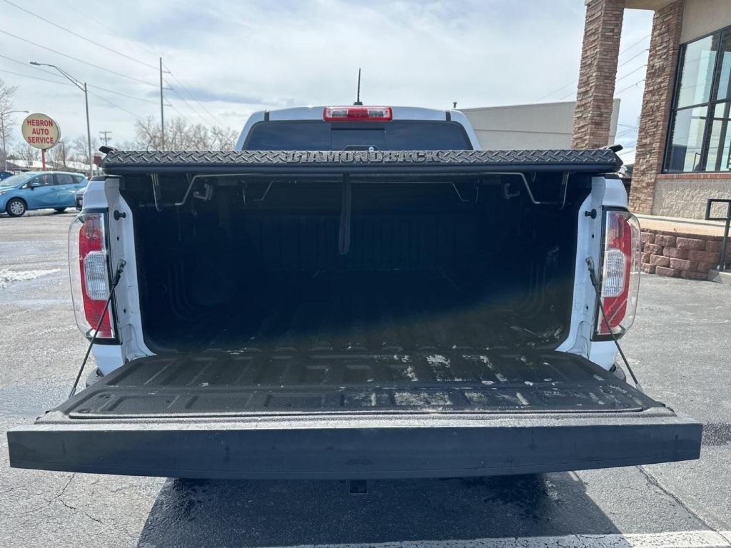 2015 Summit White /Black GMC Canyon SLE1 (1GTG6BE3XF1) with an 3.6L V6 DGI DOHC VVT engine, Automatic transmission, located at 8595 Washington St., Thornton, CO, 80229, (303) 287-5511, 39.852348, -104.978447 - 2015 GMC Canyon Clean Carfax, No Accident, Non Smoker, Non Pet Truck, Backup Camera, Leather, Power Seats, LIFTED and hard tonneau cover with locks.Canyon SLE1, 3.6L V6 DGI DOHC VVT, 4WD.<br><br> D1 Auto NEVER charges dealer fees! All cars have clean titles and have been inspected for mechanical iss - Photo#7