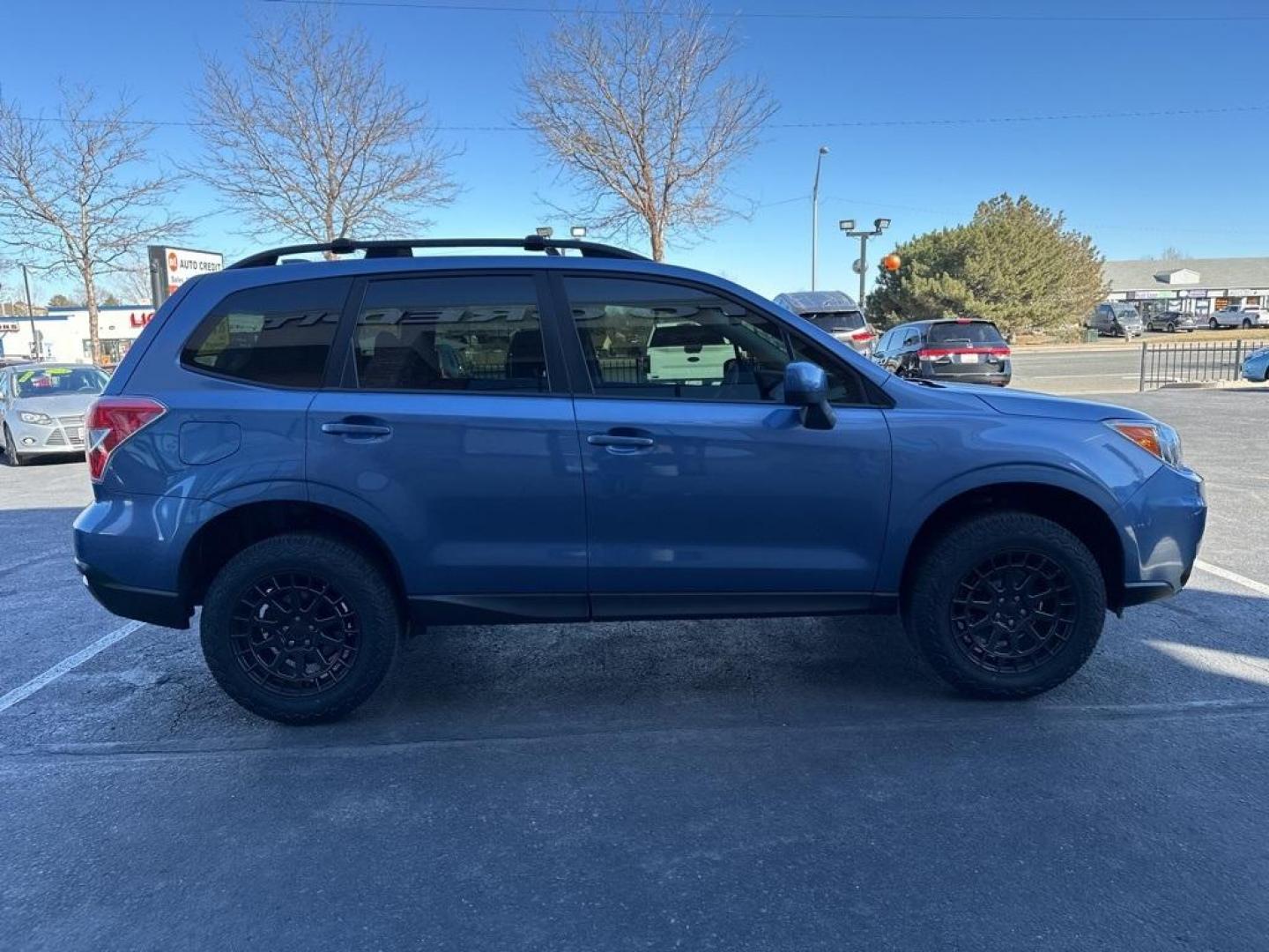 2016 Quartz Blue Pearl /Gray Subaru Forester 2.5i Premium (JF2SJAFC1GH) with an 2.5L 4-Cylinder DOHC 16V VVT engine, CVT transmission, located at 8595 Washington St., Thornton, CO, 80229, (303) 287-5511, 39.852348, -104.978447 - 2016 Subaru Forester Clean Carfax, No Accident, 2 inch lift with New Tires, Backup Camera, Heated Seats, Bluetooth/ With Bluetooth Audio, LIFTED!, AWD. <br><br>D1 Auto NEVER charges dealer fees! All cars have clean titles and have been inspected for mechanical issues. We have financing for everyone. - Photo#4