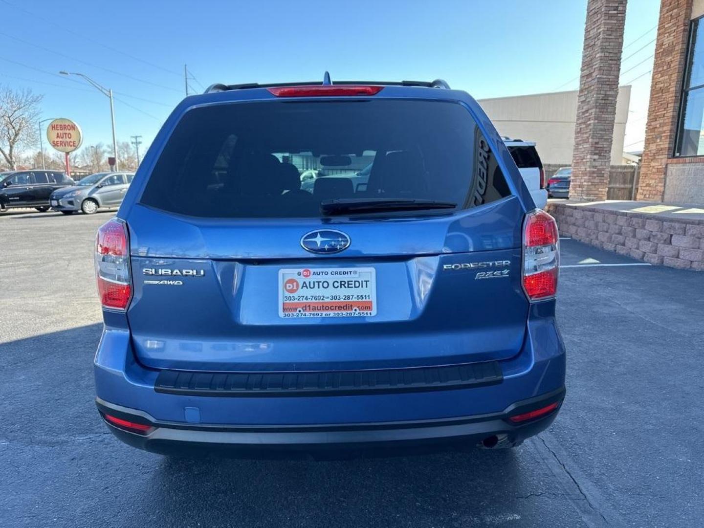 2016 Quartz Blue Pearl /Gray Subaru Forester 2.5i Premium (JF2SJAFC1GH) with an 2.5L 4-Cylinder DOHC 16V VVT engine, CVT transmission, located at 8595 Washington St., Thornton, CO, 80229, (303) 287-5511, 39.852348, -104.978447 - 2016 Subaru Forester Clean Carfax, No Accident, 2 inch lift with New Tires, Backup Camera, Heated Seats, Bluetooth/ With Bluetooth Audio, LIFTED!, AWD. <br><br>D1 Auto NEVER charges dealer fees! All cars have clean titles and have been inspected for mechanical issues. We have financing for everyone. - Photo#6