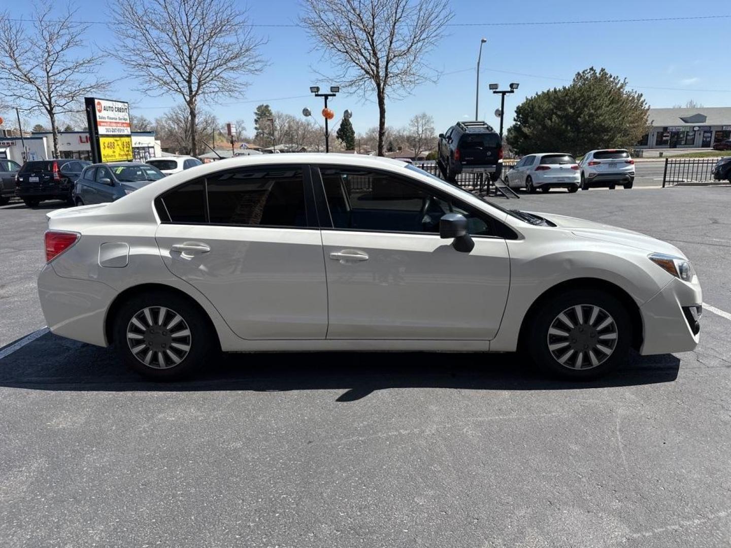 2016 Crystal White Pearl /Black Subaru Impreza 2.0i (JF1GJAA67GH) with an 2.0L 4-Cylinder DOHC 16V engine, CVT transmission, located at 8595 Washington St., Thornton, CO, 80229, (303) 287-5511, 39.852348, -104.978447 - 2016 Subaru Impreza All Wheel Drive<br><br>All Cars Have Clean Titles And Are Serviced Before Sale., Clean Carfax, No Accident, Backup Camera, Non Smoker, No Pet Odor Or Hair, Impreza 2.0i, AWD.<br><br>D1 Auto NEVER charges dealer fees! All cars have clean titles and have been inspected for mechanic - Photo#4