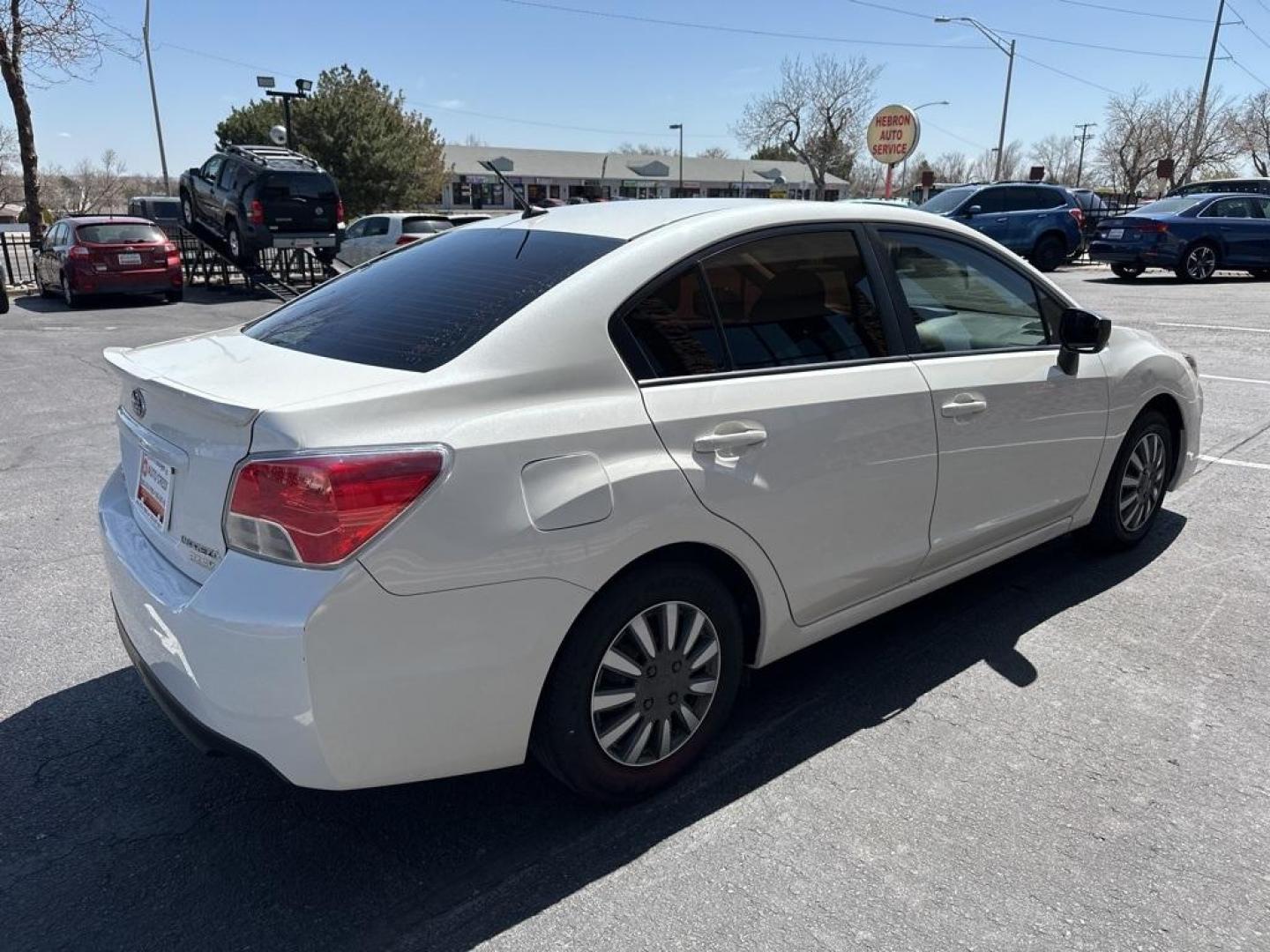 2016 Crystal White Pearl /Black Subaru Impreza 2.0i (JF1GJAA67GH) with an 2.0L 4-Cylinder DOHC 16V engine, CVT transmission, located at 8595 Washington St., Thornton, CO, 80229, (303) 287-5511, 39.852348, -104.978447 - 2016 Subaru Impreza All Wheel Drive<br><br>All Cars Have Clean Titles And Are Serviced Before Sale., Clean Carfax, No Accident, Backup Camera, Non Smoker, No Pet Odor Or Hair, Impreza 2.0i, AWD.<br><br>D1 Auto NEVER charges dealer fees! All cars have clean titles and have been inspected for mechanic - Photo#5