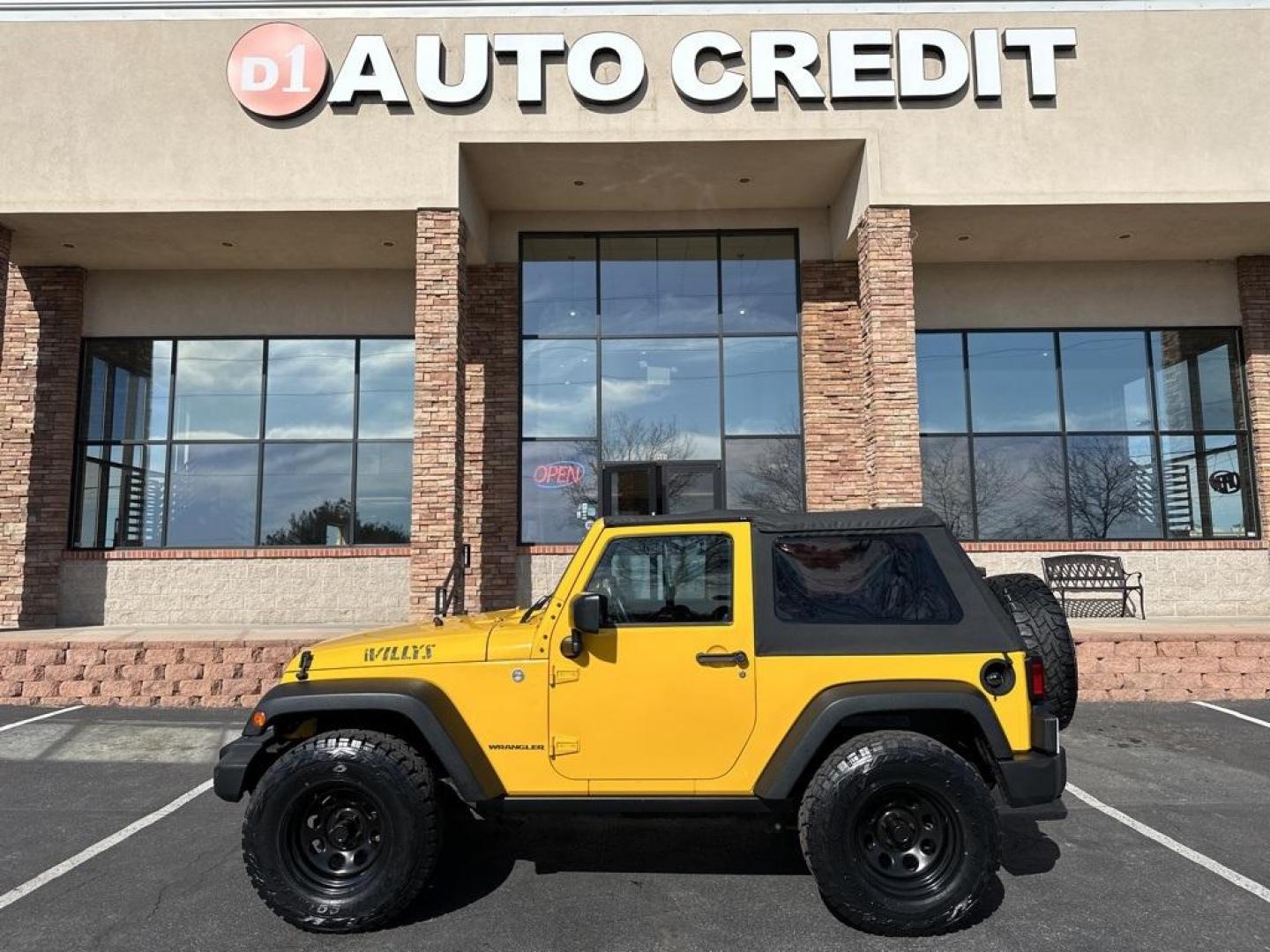 2015 Baja Yellow Clearcoat /Black Jeep Wrangler Willys Wheeler (1C4AJWAG6FL) with an 3.6L V6 24V VVT engine, Manual transmission, located at 8595 Washington St., Thornton, CO, 80229, (303) 287-5511, 39.852348, -104.978447 - 2015 Jeep Wrangler<br><br>D1 Auto NEVER charges dealer fees! All cars have clean titles and have been inspected for mechanical issues. We have financing for everyone. Good credit, bad credit, first time buyers.<br>Clean CARFAX.<br>Please call Lakewood Location 303-274-7692 or Thornton 303-287-5511 t - Photo#0