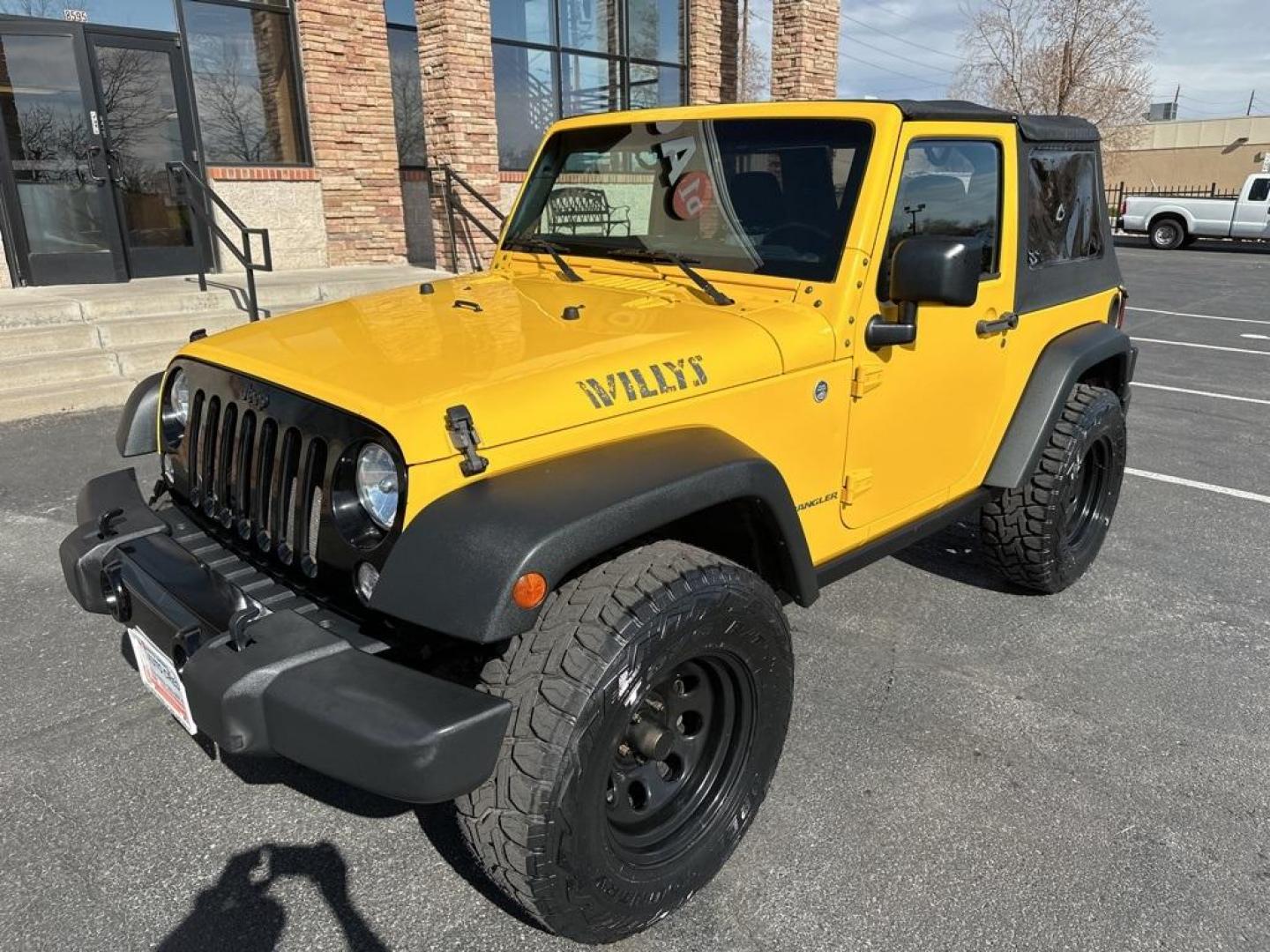 2015 Baja Yellow Clearcoat /Black Jeep Wrangler Willys Wheeler (1C4AJWAG6FL) with an 3.6L V6 24V VVT engine, Manual transmission, located at 8595 Washington St., Thornton, CO, 80229, (303) 287-5511, 39.852348, -104.978447 - 2015 Jeep Wrangler<br><br>D1 Auto NEVER charges dealer fees! All cars have clean titles and have been inspected for mechanical issues. We have financing for everyone. Good credit, bad credit, first time buyers.<br>Clean CARFAX.<br>Please call Lakewood Location 303-274-7692 or Thornton 303-287-5511 t - Photo#1