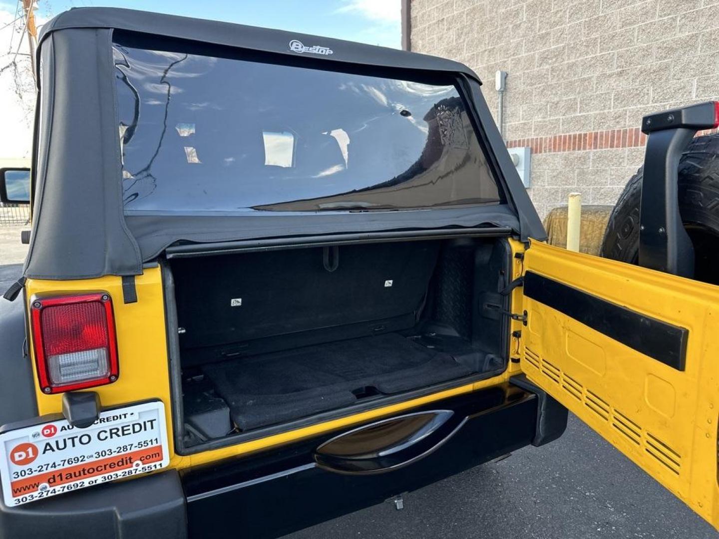 2015 Baja Yellow Clearcoat /Black Jeep Wrangler Willys Wheeler (1C4AJWAG6FL) with an 3.6L V6 24V VVT engine, Manual transmission, located at 8595 Washington St., Thornton, CO, 80229, (303) 287-5511, 39.852348, -104.978447 - 2015 Jeep Wrangler<br><br>D1 Auto NEVER charges dealer fees! All cars have clean titles and have been inspected for mechanical issues. We have financing for everyone. Good credit, bad credit, first time buyers.<br>Clean CARFAX.<br>Please call Lakewood Location 303-274-7692 or Thornton 303-287-5511 t - Photo#23