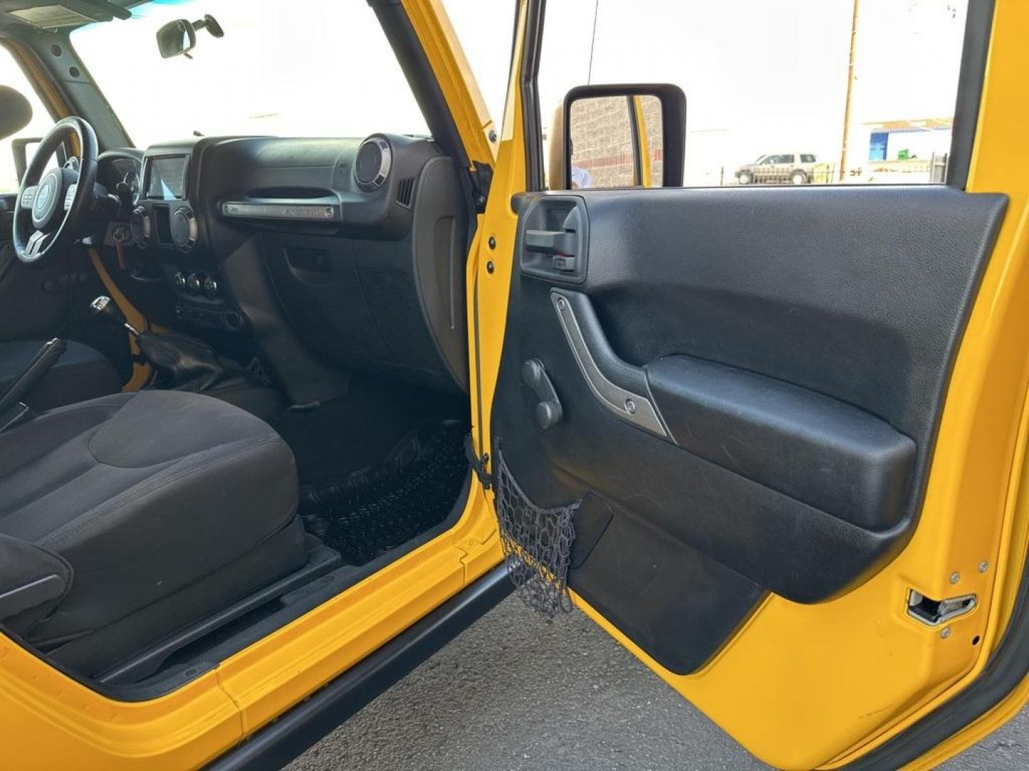 2015 Baja Yellow Clearcoat /Black Jeep Wrangler Willys Wheeler (1C4AJWAG6FL) with an 3.6L V6 24V VVT engine, Manual transmission, located at 8595 Washington St., Thornton, CO, 80229, (303) 287-5511, 39.852348, -104.978447 - 2015 Jeep Wrangler<br><br>D1 Auto NEVER charges dealer fees! All cars have clean titles and have been inspected for mechanical issues. We have financing for everyone. Good credit, bad credit, first time buyers.<br>Clean CARFAX.<br>Please call Lakewood Location 303-274-7692 or Thornton 303-287-5511 t - Photo#24