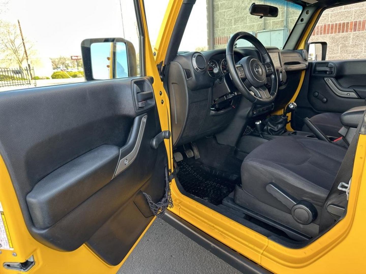 2015 Baja Yellow Clearcoat /Black Jeep Wrangler Willys Wheeler (1C4AJWAG6FL) with an 3.6L V6 24V VVT engine, Manual transmission, located at 8595 Washington St., Thornton, CO, 80229, (303) 287-5511, 39.852348, -104.978447 - 2015 Jeep Wrangler<br><br>D1 Auto NEVER charges dealer fees! All cars have clean titles and have been inspected for mechanical issues. We have financing for everyone. Good credit, bad credit, first time buyers.<br>Clean CARFAX.<br>Please call Lakewood Location 303-274-7692 or Thornton 303-287-5511 t - Photo#25