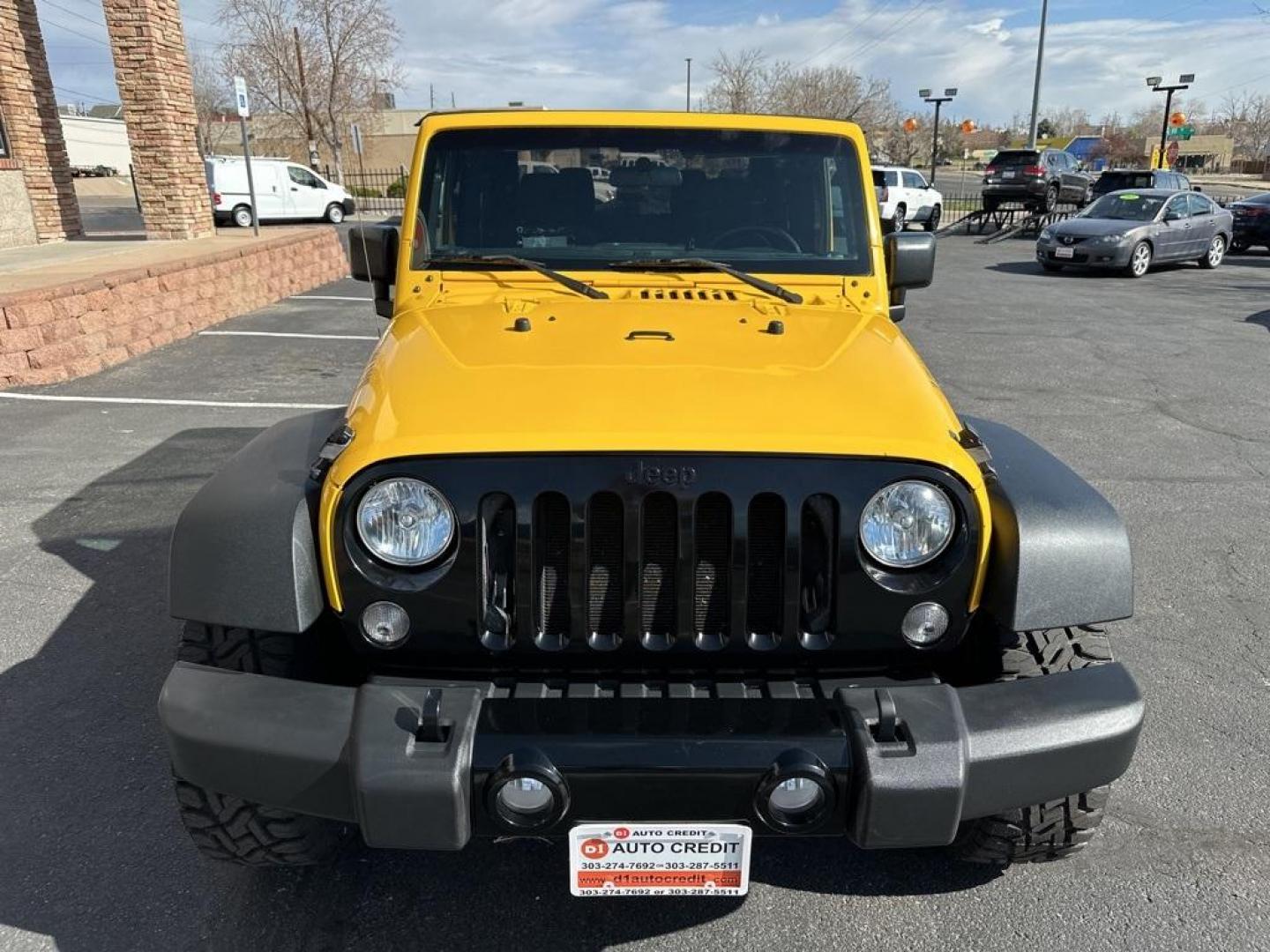 2015 Baja Yellow Clearcoat /Black Jeep Wrangler Willys Wheeler (1C4AJWAG6FL) with an 3.6L V6 24V VVT engine, Manual transmission, located at 8595 Washington St., Thornton, CO, 80229, (303) 287-5511, 39.852348, -104.978447 - 2015 Jeep Wrangler<br><br>D1 Auto NEVER charges dealer fees! All cars have clean titles and have been inspected for mechanical issues. We have financing for everyone. Good credit, bad credit, first time buyers.<br>Clean CARFAX.<br>Please call Lakewood Location 303-274-7692 or Thornton 303-287-5511 t - Photo#2