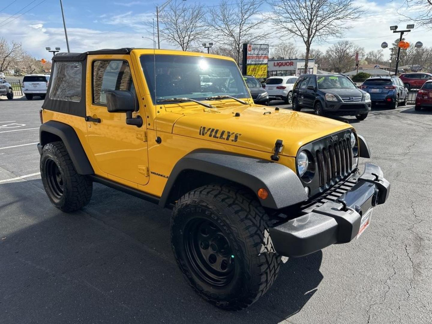 2015 Baja Yellow Clearcoat /Black Jeep Wrangler Willys Wheeler (1C4AJWAG6FL) with an 3.6L V6 24V VVT engine, Manual transmission, located at 8595 Washington St., Thornton, CO, 80229, (303) 287-5511, 39.852348, -104.978447 - 2015 Jeep Wrangler<br><br>D1 Auto NEVER charges dealer fees! All cars have clean titles and have been inspected for mechanical issues. We have financing for everyone. Good credit, bad credit, first time buyers.<br>Clean CARFAX.<br>Please call Lakewood Location 303-274-7692 or Thornton 303-287-5511 t - Photo#3