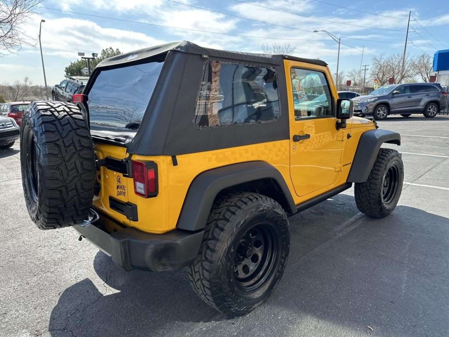 2015 Baja Yellow Clearcoat /Black Jeep Wrangler Willys Wheeler (1C4AJWAG6FL) with an 3.6L V6 24V VVT engine, Manual transmission, located at 8595 Washington St., Thornton, CO, 80229, (303) 287-5511, 39.852348, -104.978447 - 2015 Jeep Wrangler<br><br>D1 Auto NEVER charges dealer fees! All cars have clean titles and have been inspected for mechanical issues. We have financing for everyone. Good credit, bad credit, first time buyers.<br>Clean CARFAX.<br>Please call Lakewood Location 303-274-7692 or Thornton 303-287-5511 t - Photo#5