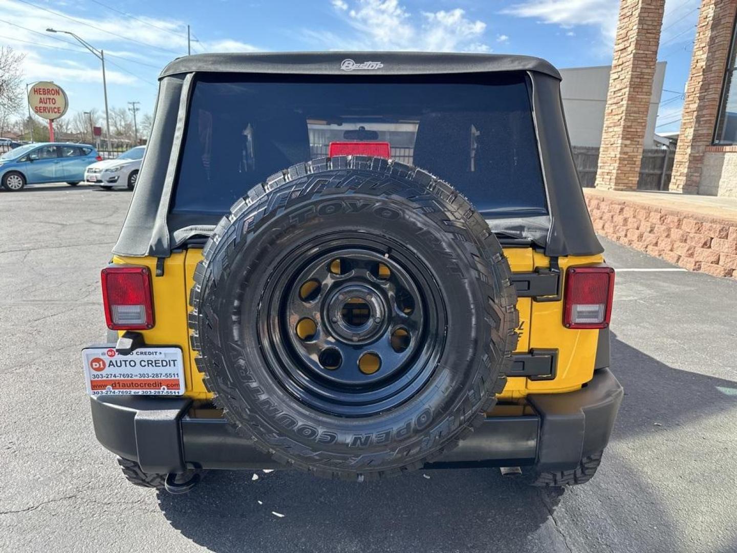 2015 Baja Yellow Clearcoat /Black Jeep Wrangler Willys Wheeler (1C4AJWAG6FL) with an 3.6L V6 24V VVT engine, Manual transmission, located at 8595 Washington St., Thornton, CO, 80229, (303) 287-5511, 39.852348, -104.978447 - 2015 Jeep Wrangler<br><br>D1 Auto NEVER charges dealer fees! All cars have clean titles and have been inspected for mechanical issues. We have financing for everyone. Good credit, bad credit, first time buyers.<br>Clean CARFAX.<br>Please call Lakewood Location 303-274-7692 or Thornton 303-287-5511 t - Photo#6