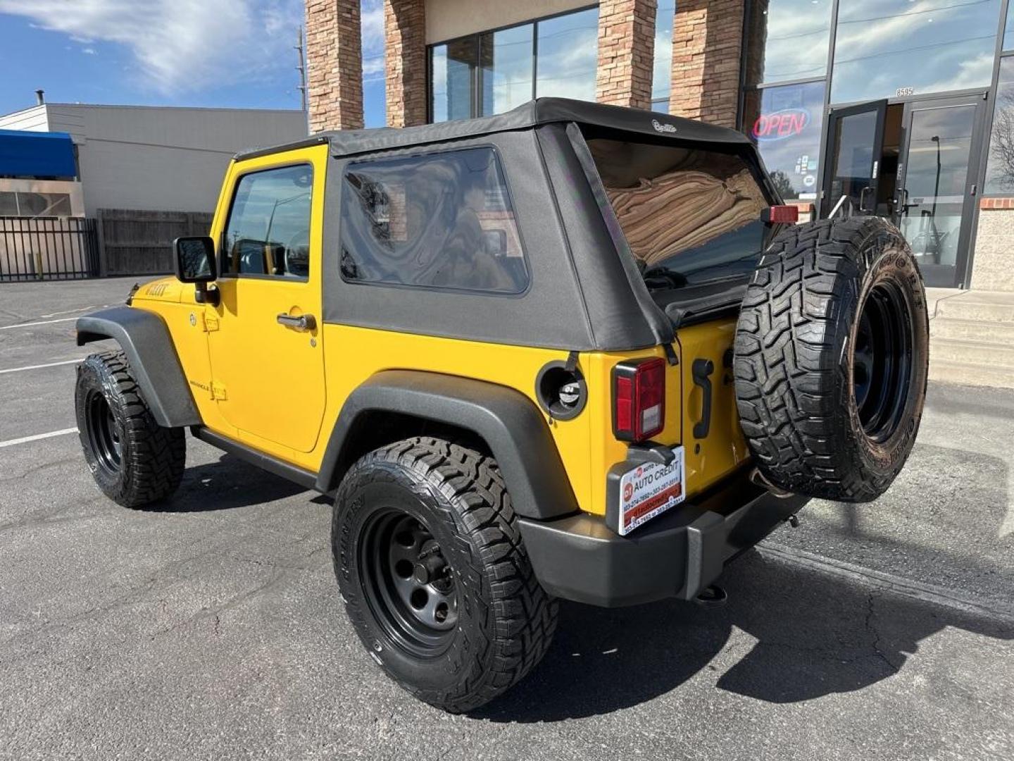 2015 Baja Yellow Clearcoat /Black Jeep Wrangler Willys Wheeler (1C4AJWAG6FL) with an 3.6L V6 24V VVT engine, Manual transmission, located at 8595 Washington St., Thornton, CO, 80229, (303) 287-5511, 39.852348, -104.978447 - 2015 Jeep Wrangler<br><br>D1 Auto NEVER charges dealer fees! All cars have clean titles and have been inspected for mechanical issues. We have financing for everyone. Good credit, bad credit, first time buyers.<br>Clean CARFAX.<br>Please call Lakewood Location 303-274-7692 or Thornton 303-287-5511 t - Photo#7