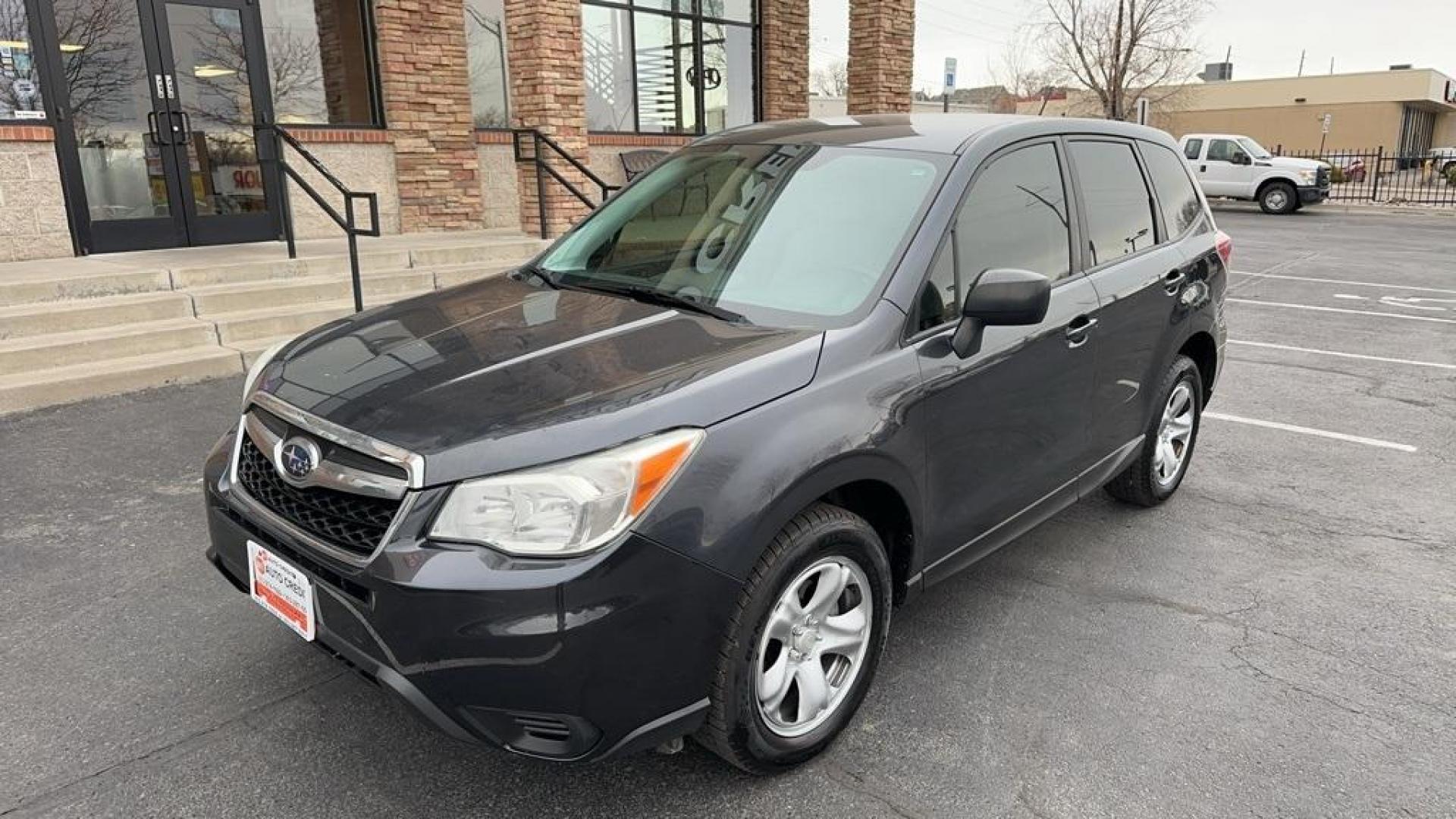 2014 Dark Gray Metallic /Gray Subaru Forester 2.5i (JF2SJAAC2EH) with an 2.5L 4-Cylinder DOHC 16V VVT engine, CVT transmission, located at 8595 Washington St., Thornton, CO, 80229, (303) 287-5511, 39.852348, -104.978447 - 2014 Subaru Forester<br>Clean Carfax, No Accident, All Books and Keys, Backup Camera, Non Smoker, No Pet Odor Or Hair, AWD.<br><br>D1 Auto NEVER charges dealer fees! All cars have clean titles and have been inspected for mechanical issues. We have financing for everyone. Good credit, bad credit, fir - Photo#1
