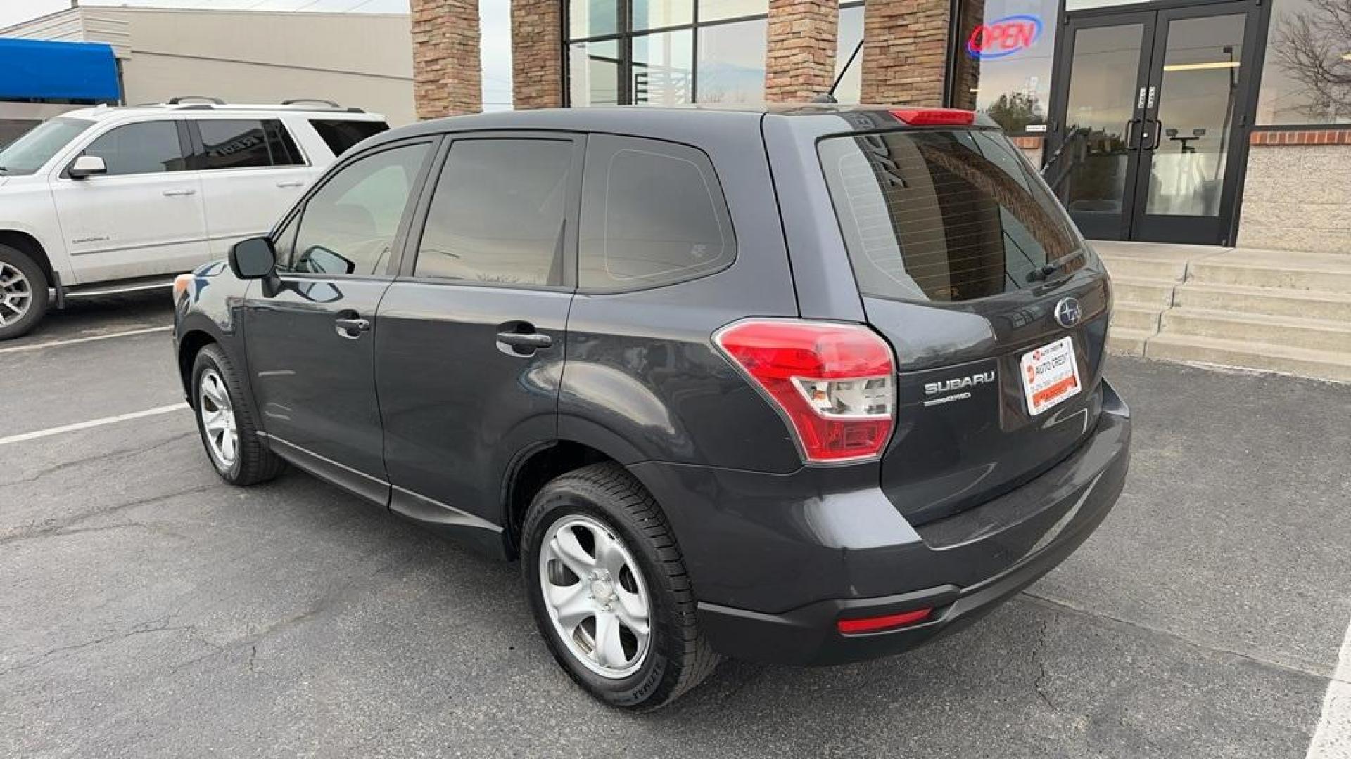 2014 Dark Gray Metallic /Gray Subaru Forester 2.5i (JF2SJAAC2EH) with an 2.5L 4-Cylinder DOHC 16V VVT engine, CVT transmission, located at 8595 Washington St., Thornton, CO, 80229, (303) 287-5511, 39.852348, -104.978447 - 2014 Subaru Forester<br>Clean Carfax, No Accident, All Books and Keys, Backup Camera, Non Smoker, No Pet Odor Or Hair, AWD.<br><br>D1 Auto NEVER charges dealer fees! All cars have clean titles and have been inspected for mechanical issues. We have financing for everyone. Good credit, bad credit, fir - Photo#7