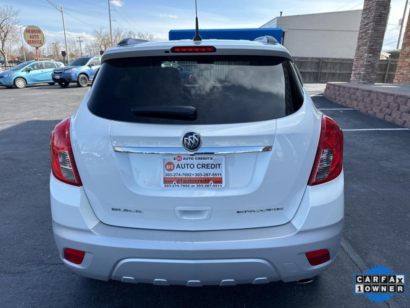 2014 White Pearl Tricoat /Ebony Buick Encore Leather (KL4CJCSB2EB) with an ECOTEC 1.4L I4 SMPI DOHC Turbocharged VVT engine, Automatic transmission, located at 8595 Washington St., Thornton, CO, 80229, (303) 287-5511, 39.852348, -104.978447 - 2014 Buick Encore<br>All Cars Have Clean Titles And Are Serviced Before Sale., CarfaxOne Owner, No Accidents, Blind Spot Monitoring, Backup Camera, Leather, Heated Seats, Bluetooth/ With Bluetooth Audio, Power Seats, Non Smoker, No Pet Odor Or Hair, FWD.<br>D1 Auto NEVER charges dealer fees! All car - Photo#6