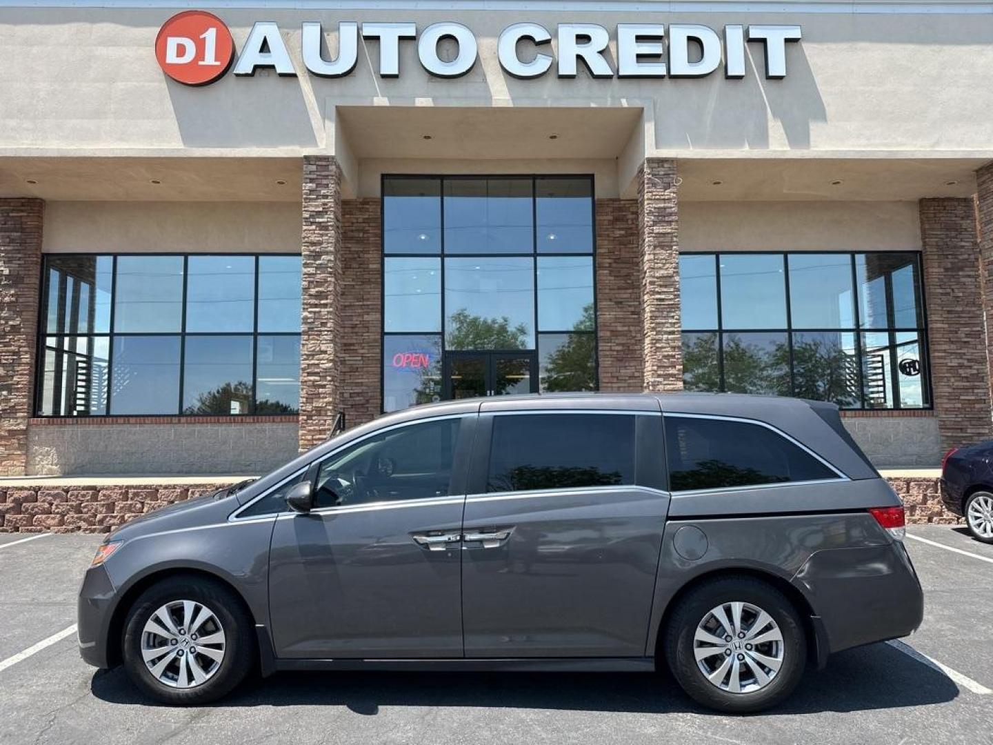 2016 Modern Steel Metallic /Gray Honda Odyssey EX-L (5FNRL5H61GB) with an 3.5L V6 SOHC i-VTEC 24V engine, Automatic transmission, located at 8595 Washington St., Thornton, CO, 80229, (303) 287-5511, 39.852348, -104.978447 - 2016 Honda Odyssey EX-L With DVD. One owner with lots of service records on Carfax including Timing Belt Service.<br><br>All Cars Have Clean Titles And Are Serviced Before Sale., Blind Spot Monitoring, Backup Camera, Leather, Heated Seats, Non Smoker, No Pet Odor Or Hair, Odyssey EX-L DVD, FWD, A/V - Photo#0