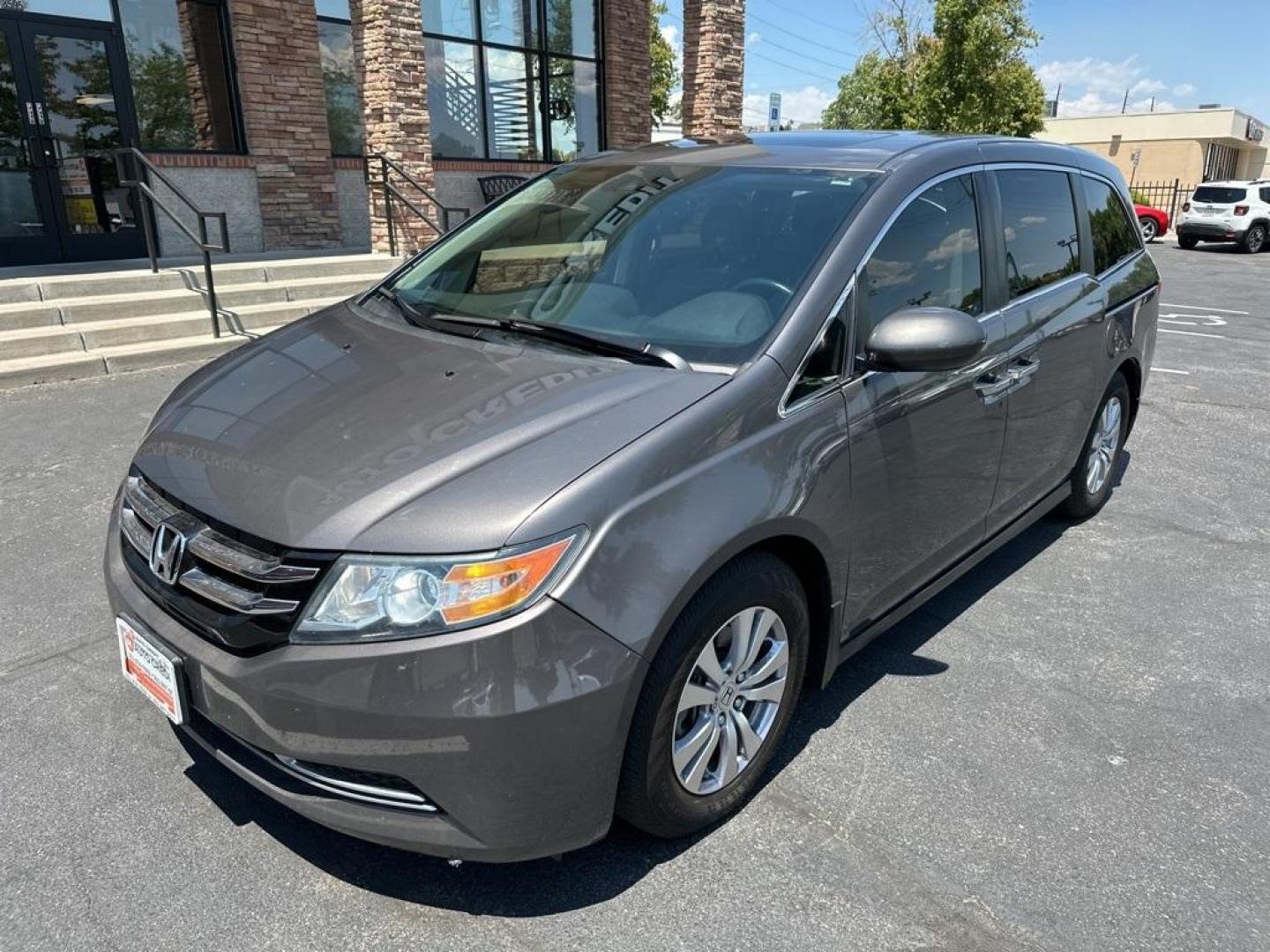 2016 Modern Steel Metallic /Gray Honda Odyssey EX-L (5FNRL5H61GB) with an 3.5L V6 SOHC i-VTEC 24V engine, Automatic transmission, located at 8595 Washington St., Thornton, CO, 80229, (303) 287-5511, 39.852348, -104.978447 - 2016 Honda Odyssey EX-L With DVD. One owner with lots of service records on Carfax including Timing Belt Service.<br><br>All Cars Have Clean Titles And Are Serviced Before Sale., Blind Spot Monitoring, Backup Camera, Leather, Heated Seats, Non Smoker, No Pet Odor Or Hair, Odyssey EX-L DVD, FWD, A/V - Photo#1