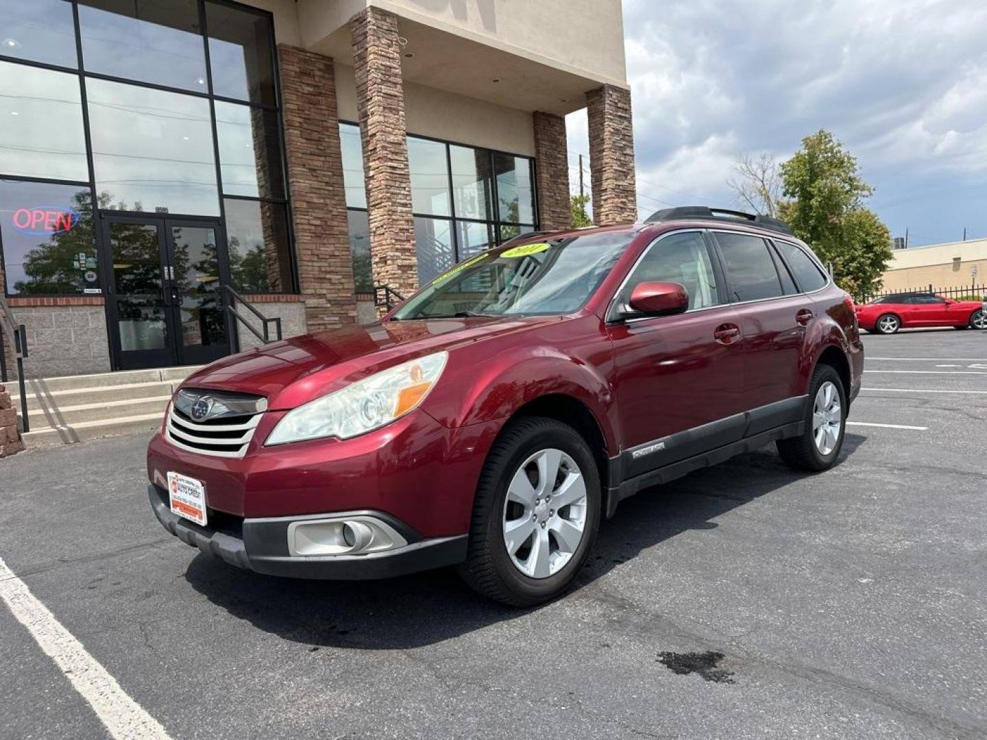 2011 Ruby Red Pearl /Ivory Subaru Outback 2.5i Premium (4S4BRBFC8B3) with an 2.5L 4-Cylinder engine, CVT transmission, located at 8595 Washington St., Thornton, CO, 80229, (303) 287-5511, 39.852348, -104.978447 - 2011 Subaru Outback<br><br>D1 Auto NEVER charges dealer fees! All cars have clean titles and have been inspected for mechanical issues. We have financing for everyone. Good credit, bad credit, first time buyers.<br>CARFAX One-Owner. Clean CARFAX. Odometer is 4040 miles below market average!<br>Pleas - Photo#1