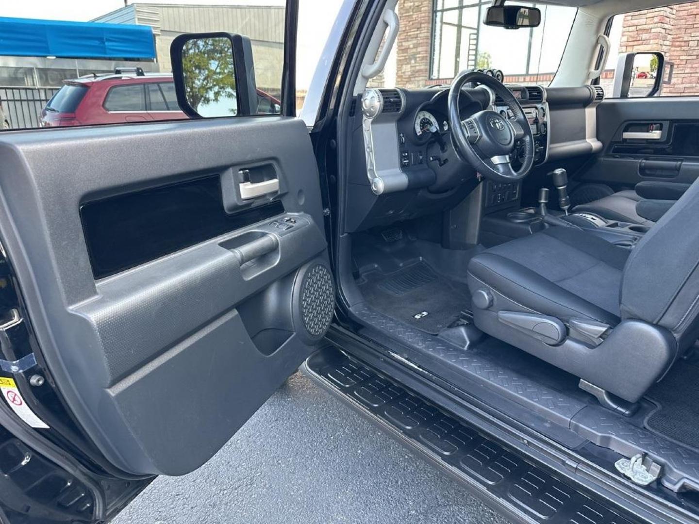 2010 Black /Dark Charcoal Toyota FJ Cruiser Upgade Package 2 (JTEBU4BF7AK) with an 4.0L V6 DOHC VVT-i 24V engine, Automatic transmission, located at 8595 Washington St., Thornton, CO, 80229, (303) 287-5511, 39.852348, -104.978447 - Toyota FJ Cruiser ONE OWNER in near mint condition with ZERO signs of abuse or off roading!! With upgade package 2 that includes, locking rear diff, 9 speaker audio and more. One owner and completley stock and never abused. Condition is everything and you wont find a cleaner one. Odometer is 87309 m - Photo#23