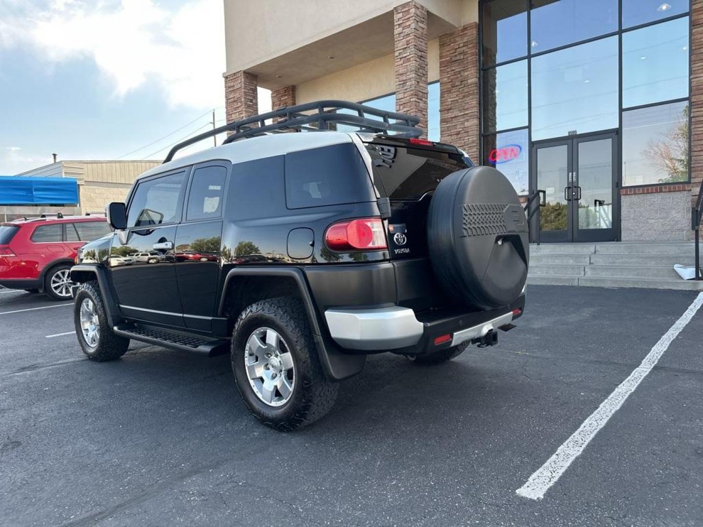 2010 Black /Dark Charcoal Toyota FJ Cruiser Upgade Package 2 (JTEBU4BF7AK) with an 4.0L V6 DOHC VVT-i 24V engine, Automatic transmission, located at 8595 Washington St., Thornton, CO, 80229, (303) 287-5511, 39.852348, -104.978447 - Toyota FJ Cruiser ONE OWNER in near mint condition with ZERO signs of abuse or off roading!! With upgade package 2 that includes, locking rear diff, 9 speaker audio and more. One owner and completley stock and never abused. Condition is everything and you wont find a cleaner one. Odometer is 87309 m - Photo#7