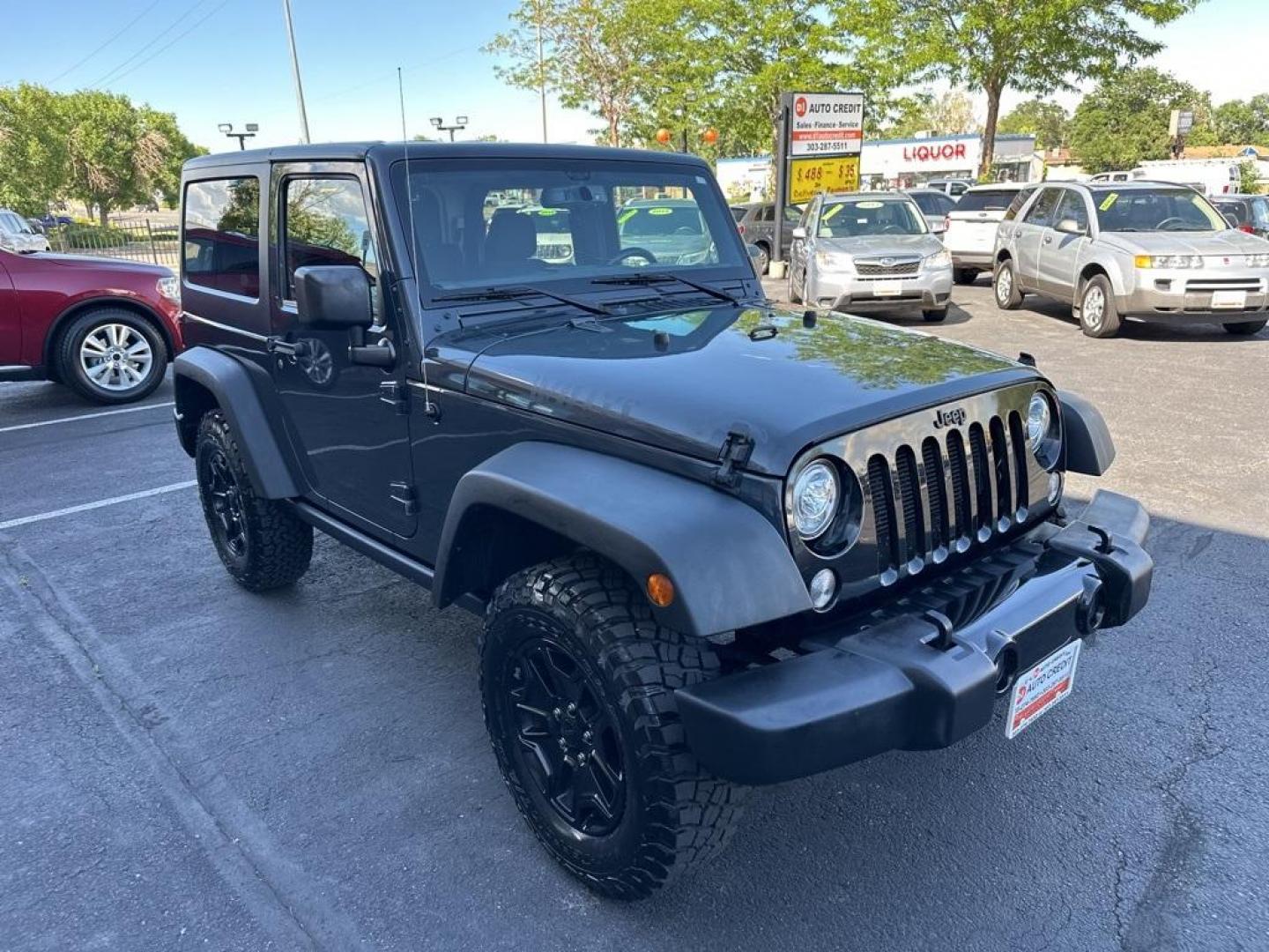 2017 Rhino Clearcoat /Black Jeep Wrangler Willys Wheeler (1C4GJWAG1HL) with an 3.6L V6 24V VVT engine, Automatic transmission, located at 8595 Washington St., Thornton, CO, 80229, (303) 287-5511, 39.852348, -104.978447 - 2017 Jeep Wrangler Willys with Wheeler Package in excellent condition with no signs of off road use. Loaded with power windows and locks, Bluetooth, Cruise Control, A/C and more. <br><br>All Cars Have Clean Titles And Are Serviced Before Sale., Clean Carfax, No Accident, New Tires, 4WD, Rhino Clear - Photo#3