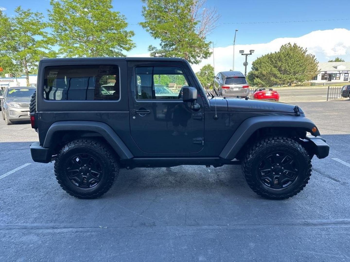 2017 Rhino Clearcoat /Black Jeep Wrangler Willys Wheeler (1C4GJWAG1HL) with an 3.6L V6 24V VVT engine, Automatic transmission, located at 8595 Washington St., Thornton, CO, 80229, (303) 287-5511, 39.852348, -104.978447 - 2017 Jeep Wrangler Willys with Wheeler Package in excellent condition with no signs of off road use. Loaded with power windows and locks, Bluetooth, Cruise Control, A/C and more. <br><br>All Cars Have Clean Titles And Are Serviced Before Sale., Clean Carfax, No Accident, New Tires, 4WD, Rhino Clear - Photo#4