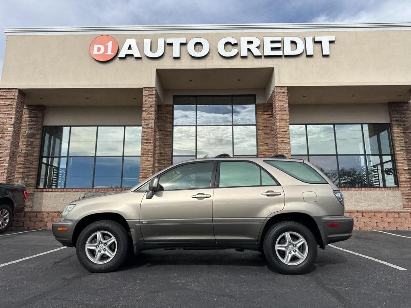 2002 Burnished Gold Metallic /Ivory Lexus RX 300 (JTJGF10U820) with an 3.0L V6 SMPI DOHC engine, Automatic transmission, located at 8595 Washington St., Thornton, CO, 80229, (303) 287-5511, 39.852348, -104.978447 - 2002 Lexus RX<br><br>D1 Auto NEVER charges dealer fees! All cars have clean titles and have been inspected for mechanical issues. We have financing for everyone. Good credit, bad credit, first time buyers.<br>Clean CARFAX.<br>Please call Lakewood Location 303-274-7692 or Thornton 303-287-5511 to sch - Photo#0