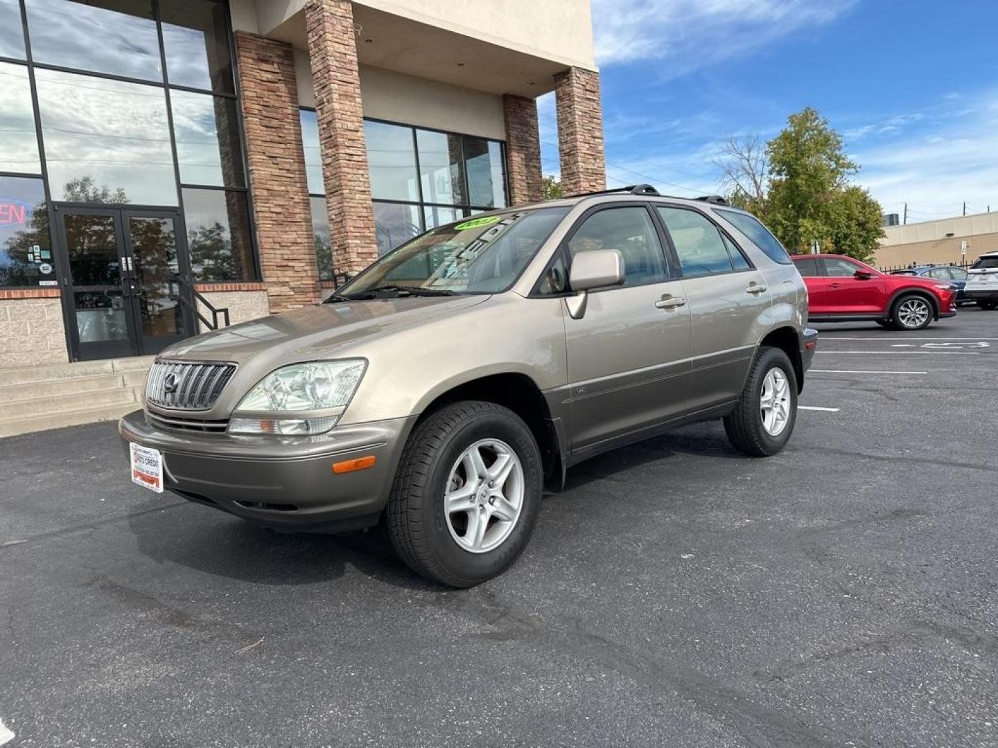 2002 Burnished Gold Metallic /Ivory Lexus RX 300 (JTJGF10U820) with an 3.0L V6 SMPI DOHC engine, Automatic transmission, located at 8595 Washington St., Thornton, CO, 80229, (303) 287-5511, 39.852348, -104.978447 - 2002 Lexus RX<br><br>D1 Auto NEVER charges dealer fees! All cars have clean titles and have been inspected for mechanical issues. We have financing for everyone. Good credit, bad credit, first time buyers.<br>Clean CARFAX.<br>Please call Lakewood Location 303-274-7692 or Thornton 303-287-5511 to sch - Photo#1