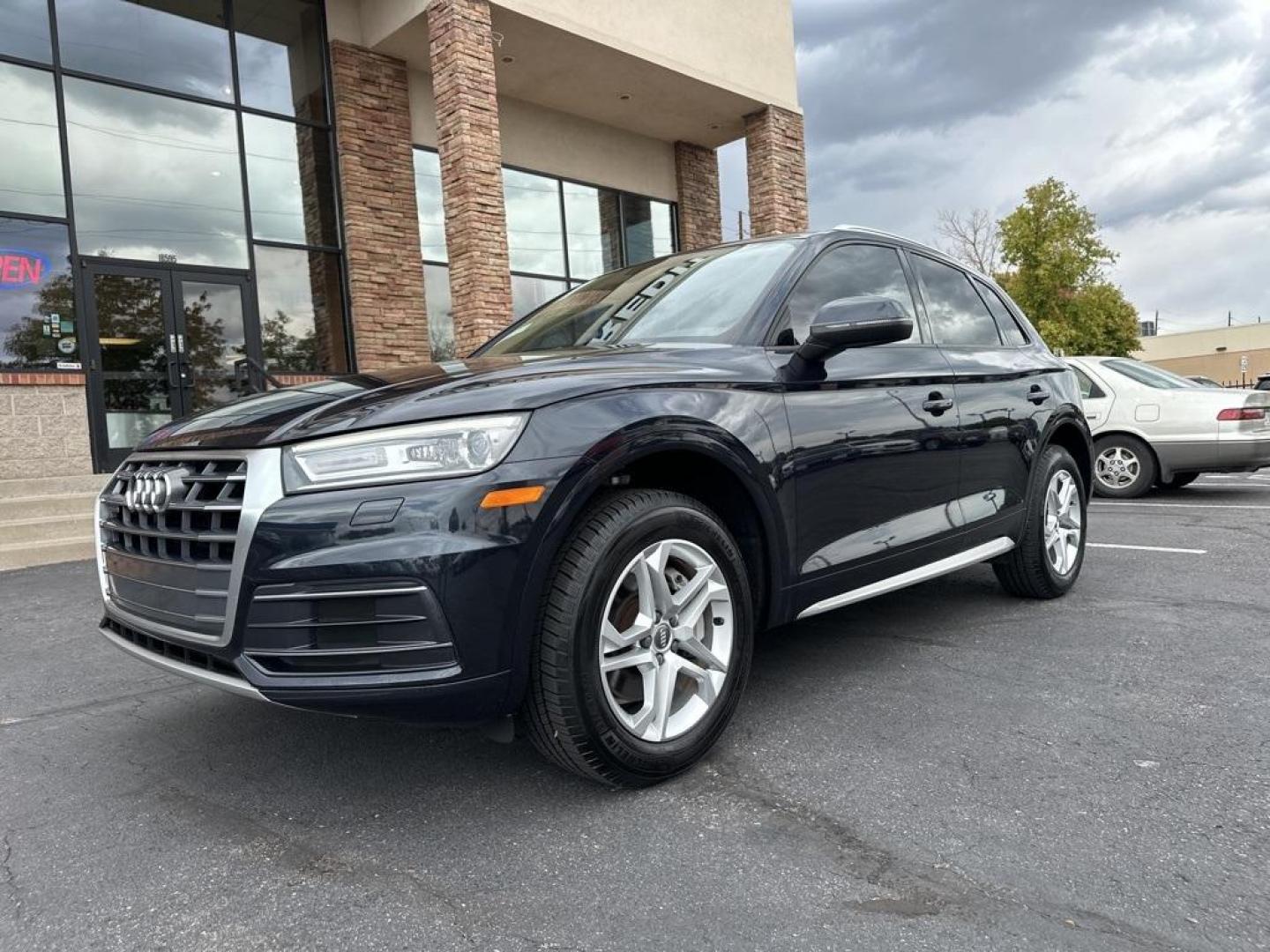 2018 Moonlight Blue Metallic /Black Audi Q5 2.0T Premium (WA1ANAFY8J2) with an 2.0L TFSI engine, Automatic transmission, located at 8595 Washington St., Thornton, CO, 80229, (303) 287-5511, 39.852348, -104.978447 - 2018 Audi Q5 One owner and not a scratch on this Audi!! Rare Moonlight Blue Metallic, this non smoker, non pet car is as clean as the day it rolled out of the factory. Truly a 10 out of 10 inside and out. New Michelin tires and fully serviced, ready for Colorado.<br><br>All Cars Have Clean Titles An - Photo#1