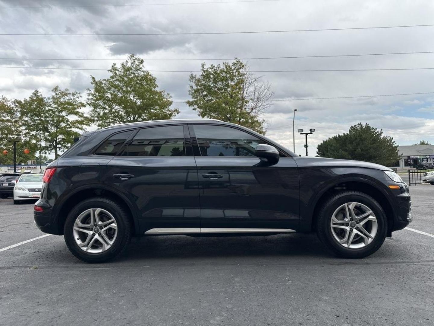 2018 Moonlight Blue Metallic /Black Audi Q5 2.0T Premium (WA1ANAFY8J2) with an 2.0L TFSI engine, Automatic transmission, located at 8595 Washington St., Thornton, CO, 80229, (303) 287-5511, 39.852348, -104.978447 - 2018 Audi Q5 One owner and not a scratch on this Audi!! Rare Moonlight Blue Metallic, this non smoker, non pet car is as clean as the day it rolled out of the factory. Truly a 10 out of 10 inside and out. New Michelin tires and fully serviced, ready for Colorado.<br><br>All Cars Have Clean Titles An - Photo#4