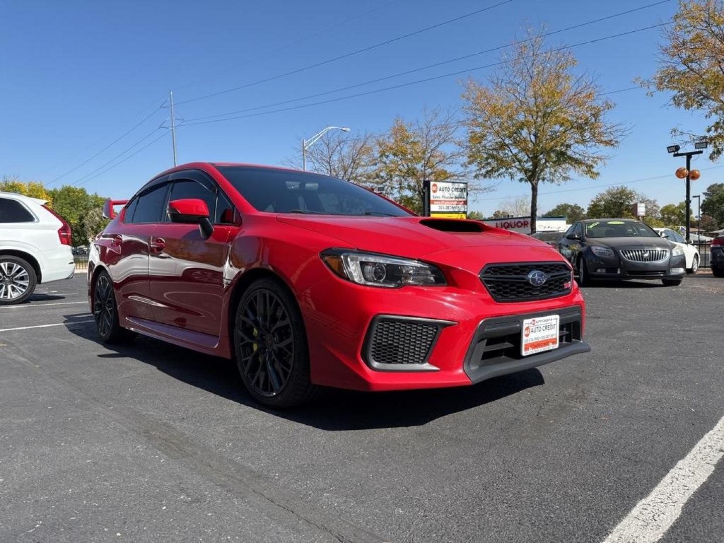 2019 Pure Red /Black/Carbon Black Subaru WRX STi (JF1VA2S64K9) with an 2.5L DOHC Intercooled High Boost Turbocharged engine, Manual transmission, located at 8595 Washington St., Thornton, CO, 80229, (303) 287-5511, 39.852348, -104.978447 - 2019 Subaru WRX STI with low miles and in excellent condition insdie and out!<br>All Cars Have Clean Titles And Are Serviced Before Sale.Apple/Android Car Play, Blind Spot Monitoring, Backup Camera, Leather, Heated Seats, Bluetooth/ With Bluetooth Audio, Non Smoker, No Pet Odor Or Hair, WRX STi, Clo - Photo#2