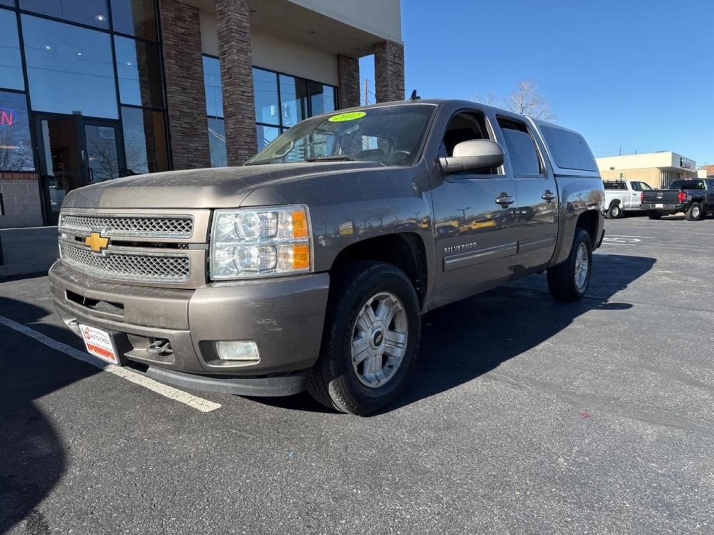 2012 Mocha Steel Metallic /Ebony Chevrolet Silverado 1500 LT (3GCPKSE76CG) with an Vortec 5.3L V8 SFI VVT Flex Fuel engine, Automatic transmission, located at 8595 Washington St., Thornton, CO, 80229, (303) 287-5511, 39.852348, -104.978447 - 2012 Chevrolet Silverado 1500 4WD Z71 <br><br>All Cars Have Clean Titles And Are Serviced Before Sale., 6-Speed Automatic Electronic with Overdrive, 4WD, Ebony Cloth, 18'' x 8'' Aluminum Wheels, Body-Colored Door Handles, Body-Colored Grille w/Unique Chrome Insert, Front Chrome Recovery Hooks, Heate - Photo#0