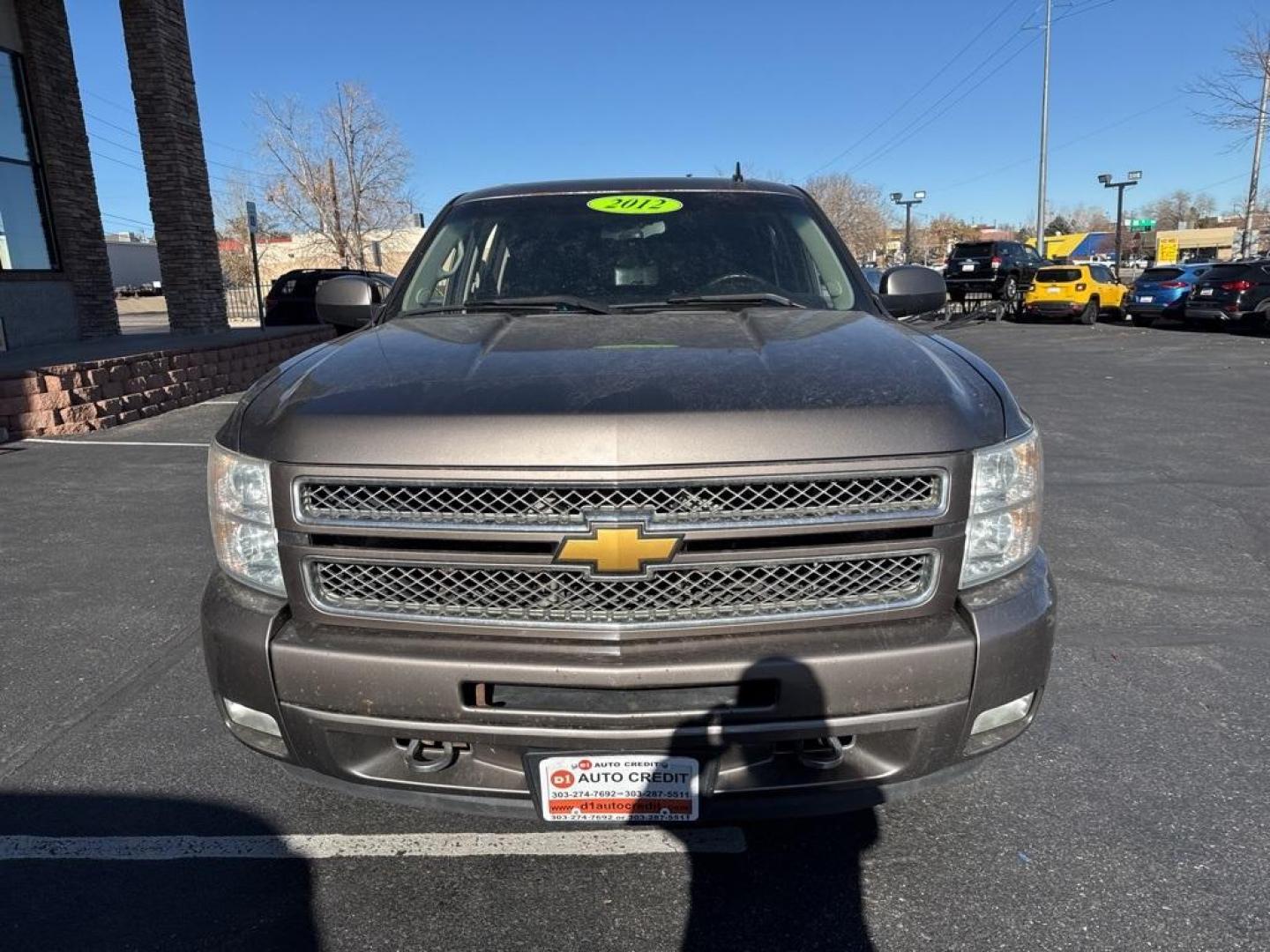 2012 Mocha Steel Metallic /Ebony Chevrolet Silverado 1500 LT (3GCPKSE76CG) with an Vortec 5.3L V8 SFI VVT Flex Fuel engine, Automatic transmission, located at 8595 Washington St., Thornton, CO, 80229, (303) 287-5511, 39.852348, -104.978447 - 2012 Chevrolet Silverado 1500 4WD Z71 <br><br>All Cars Have Clean Titles And Are Serviced Before Sale., 6-Speed Automatic Electronic with Overdrive, 4WD, Ebony Cloth, 18'' x 8'' Aluminum Wheels, Body-Colored Door Handles, Body-Colored Grille w/Unique Chrome Insert, Front Chrome Recovery Hooks, Heate - Photo#1