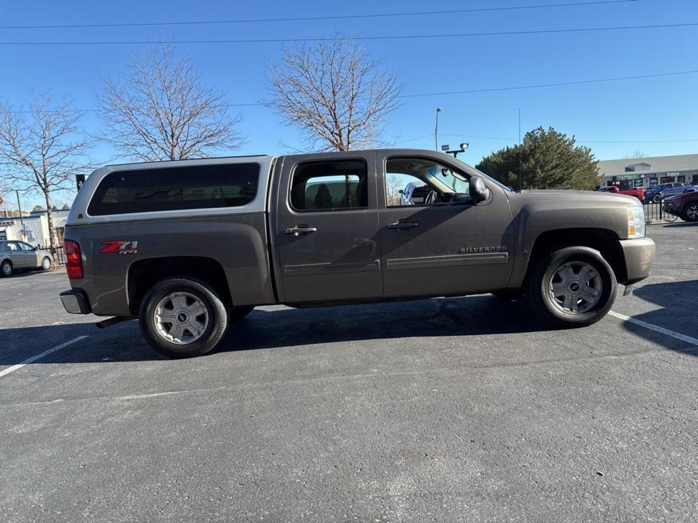 2012 Mocha Steel Metallic /Ebony Chevrolet Silverado 1500 LT (3GCPKSE76CG) with an Vortec 5.3L V8 SFI VVT Flex Fuel engine, Automatic transmission, located at 8595 Washington St., Thornton, CO, 80229, (303) 287-5511, 39.852348, -104.978447 - 2012 Chevrolet Silverado 1500 4WD Z71 <br><br>All Cars Have Clean Titles And Are Serviced Before Sale., 6-Speed Automatic Electronic with Overdrive, 4WD, Ebony Cloth, 18'' x 8'' Aluminum Wheels, Body-Colored Door Handles, Body-Colored Grille w/Unique Chrome Insert, Front Chrome Recovery Hooks, Heate - Photo#3