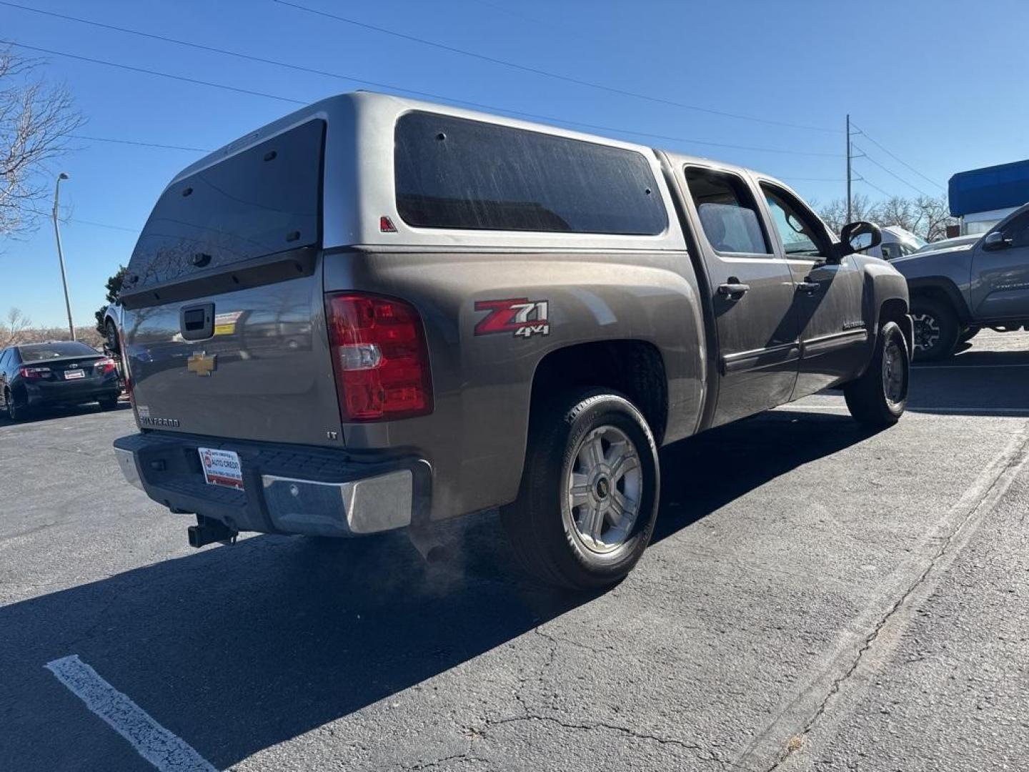 2012 Mocha Steel Metallic /Ebony Chevrolet Silverado 1500 LT (3GCPKSE76CG) with an Vortec 5.3L V8 SFI VVT Flex Fuel engine, Automatic transmission, located at 8595 Washington St., Thornton, CO, 80229, (303) 287-5511, 39.852348, -104.978447 - 2012 Chevrolet Silverado 1500 4WD Z71 <br><br>All Cars Have Clean Titles And Are Serviced Before Sale., 6-Speed Automatic Electronic with Overdrive, 4WD, Ebony Cloth, 18'' x 8'' Aluminum Wheels, Body-Colored Door Handles, Body-Colored Grille w/Unique Chrome Insert, Front Chrome Recovery Hooks, Heate - Photo#4