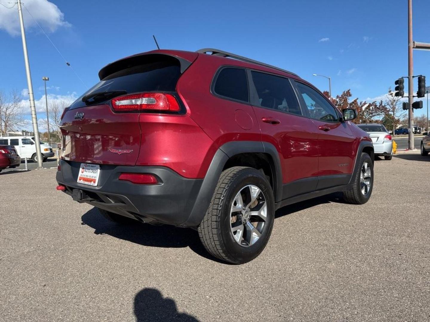 2014 Deep Cherry Red Crystal Pearlcoat /Black Jeep Cherokee Trailhawk (1C4PJMBS0EW) with an 3.2L V6 engine, Automatic transmission, located at 8595 Washington St., Thornton, CO, 80229, (303) 287-5511, 39.852348, -104.978447 - 2014 Jeep Cherokee with very low miles and in excellent condition inside and out. Loaded with the powerful V6 engine, panoramic sun roof, heated leather seats, heated steering wheel, navigation, backup camera and much more. Fully serviced in our shop. We offer a wide range of warranties. <br><br>All - Photo#4