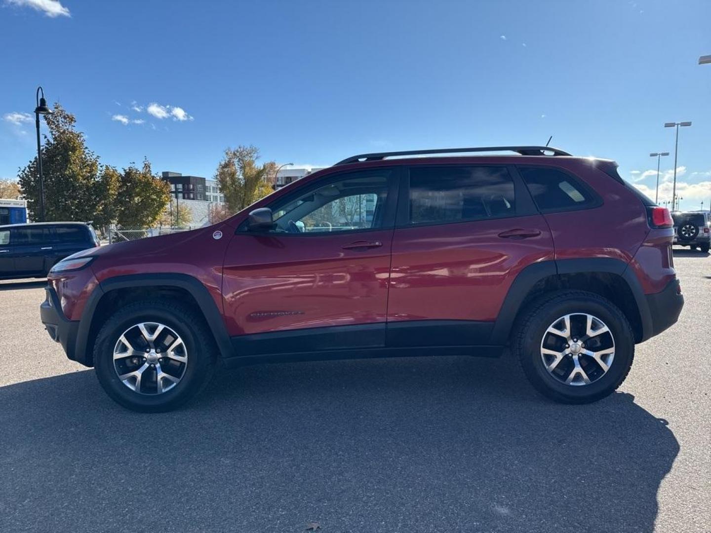 2014 Deep Cherry Red Crystal Pearlcoat /Black Jeep Cherokee Trailhawk (1C4PJMBS0EW) with an 3.2L V6 engine, Automatic transmission, located at 8595 Washington St., Thornton, CO, 80229, (303) 287-5511, 39.852348, -104.978447 - 2014 Jeep Cherokee with very low miles and in excellent condition inside and out. Loaded with the powerful V6 engine, panoramic sun roof, heated leather seats, heated steering wheel, navigation, backup camera and much more. Fully serviced in our shop. We offer a wide range of warranties. <br><br>All - Photo#7