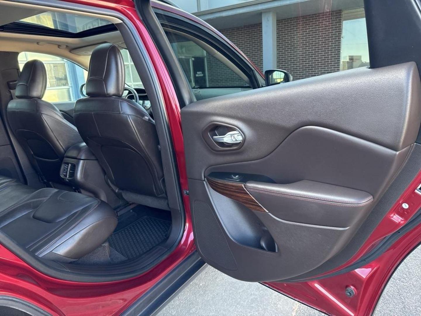 2014 Deep Cherry Red Crystal Pearlcoat /Black Jeep Cherokee Trailhawk (1C4PJMBS0EW) with an 3.2L V6 engine, Automatic transmission, located at 8595 Washington St., Thornton, CO, 80229, (303) 287-5511, 39.852348, -104.978447 - 2014 Jeep Cherokee with very low miles and in excellent condition inside and out. Loaded with the powerful V6 engine, panoramic sun roof, heated leather seats, heated steering wheel, navigation, backup camera and much more. Fully serviced in our shop. We offer a wide range of warranties. <br><br>All - Photo#21