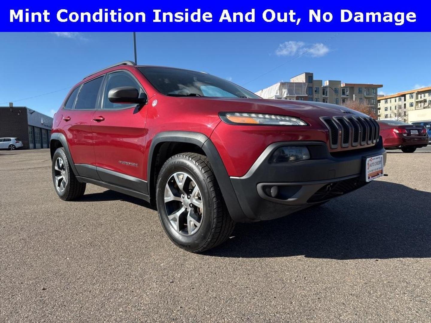 2014 Deep Cherry Red Crystal Pearlcoat /Black Jeep Cherokee Trailhawk (1C4PJMBS0EW) with an 3.2L V6 engine, Automatic transmission, located at 8595 Washington St., Thornton, CO, 80229, (303) 287-5511, 39.852348, -104.978447 - 2014 Jeep Cherokee with very low miles and in excellent condition inside and out. Loaded with the powerful V6 engine, panoramic sun roof, heated leather seats, heated steering wheel, navigation, backup camera and much more. Fully serviced in our shop. We offer a wide range of warranties. <br><br>All - Photo#2