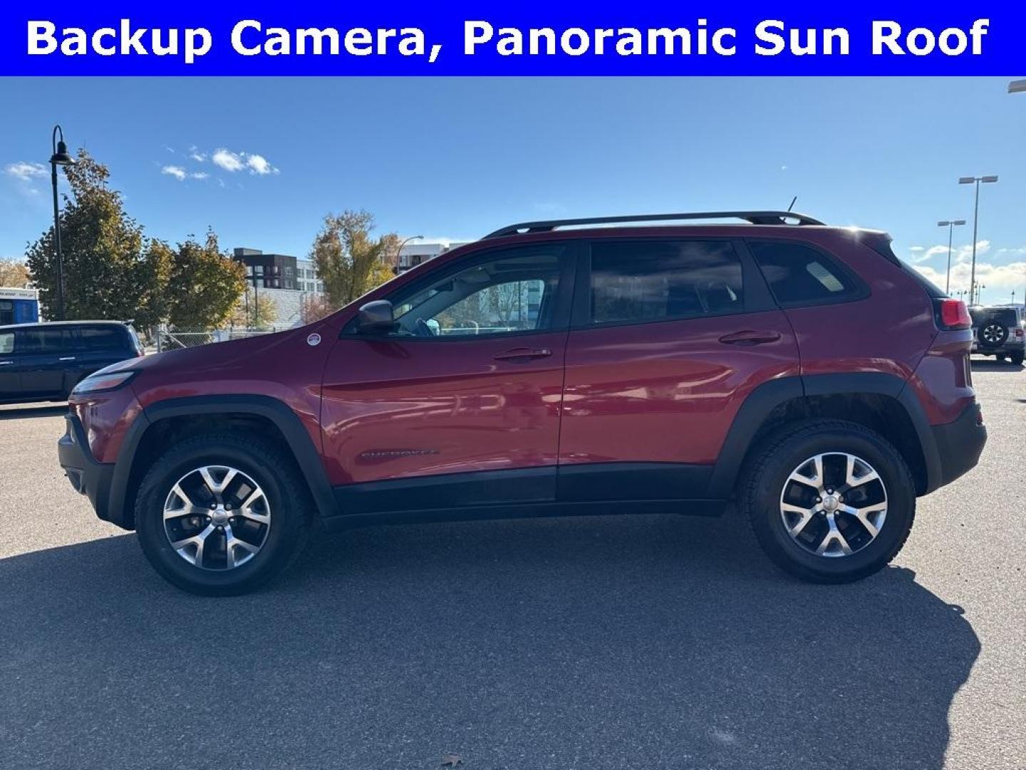 2014 Deep Cherry Red Crystal Pearlcoat /Black Jeep Cherokee Trailhawk (1C4PJMBS0EW) with an 3.2L V6 engine, Automatic transmission, located at 8595 Washington St., Thornton, CO, 80229, (303) 287-5511, 39.852348, -104.978447 - 2014 Jeep Cherokee with very low miles and in excellent condition inside and out. Loaded with the powerful V6 engine, panoramic sun roof, heated leather seats, heated steering wheel, navigation, backup camera and much more. Fully serviced in our shop. We offer a wide range of warranties. <br><br>All - Photo#4