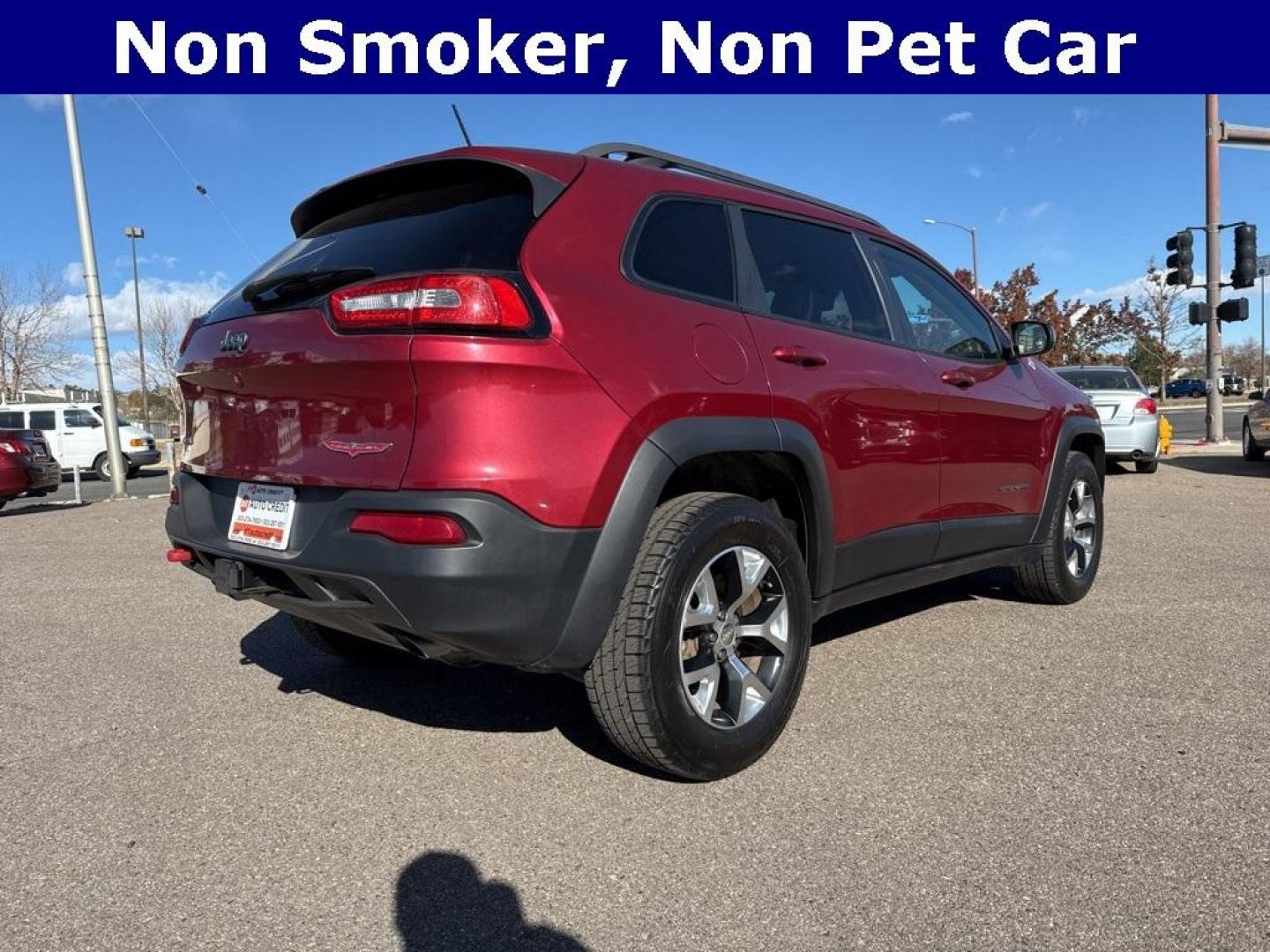 2014 Deep Cherry Red Crystal Pearlcoat /Black Jeep Cherokee Trailhawk (1C4PJMBS0EW) with an 3.2L V6 engine, Automatic transmission, located at 8595 Washington St., Thornton, CO, 80229, (303) 287-5511, 39.852348, -104.978447 - 2014 Jeep Cherokee with very low miles and in excellent condition inside and out. Loaded with the powerful V6 engine, panoramic sun roof, heated leather seats, heated steering wheel, navigation, backup camera and much more. Fully serviced in our shop. We offer a wide range of warranties. <br><br>All - Photo#5