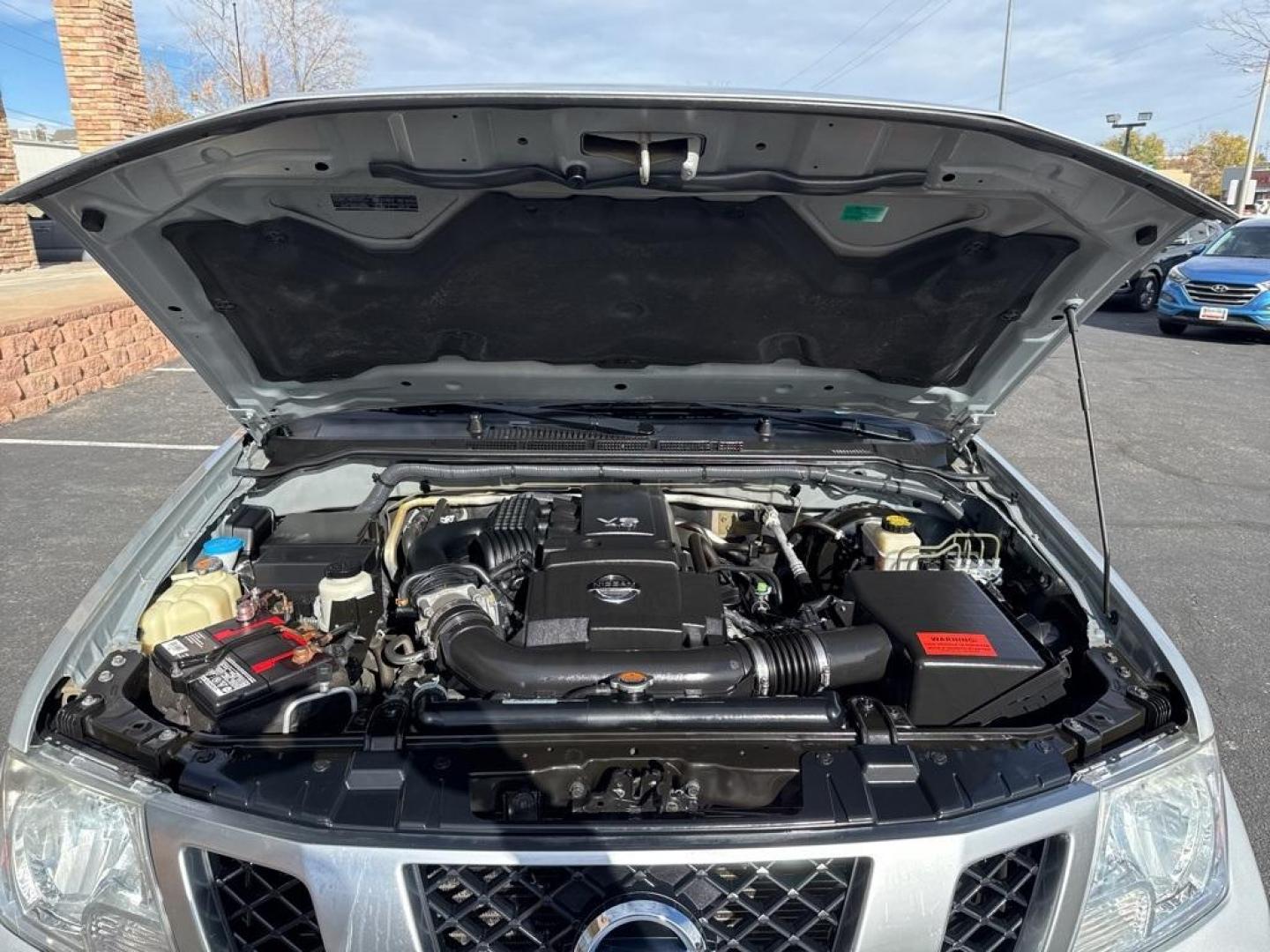 2018 Brilliant Silver /Graphite Nissan Frontier PRO-4X (1N6AD0EVXJN) with an 4.0L V6 DOHC engine, Automatic transmission, located at 8595 Washington St., Thornton, CO, 80229, (303) 287-5511, 39.852348, -104.978447 - 2018 Nissan Frontier PRO -4X 4WD in mint condition inside and out. This non smoker shows no signs of abuse anywhere and is rust free. Clean Colorado title and ready to go!! <br><br>All Cars Have Clean Titles And Are Serviced Before Sale., Clean Carfax, No Accident, Heated Seats, Apple/Android Car Pl - Photo#26