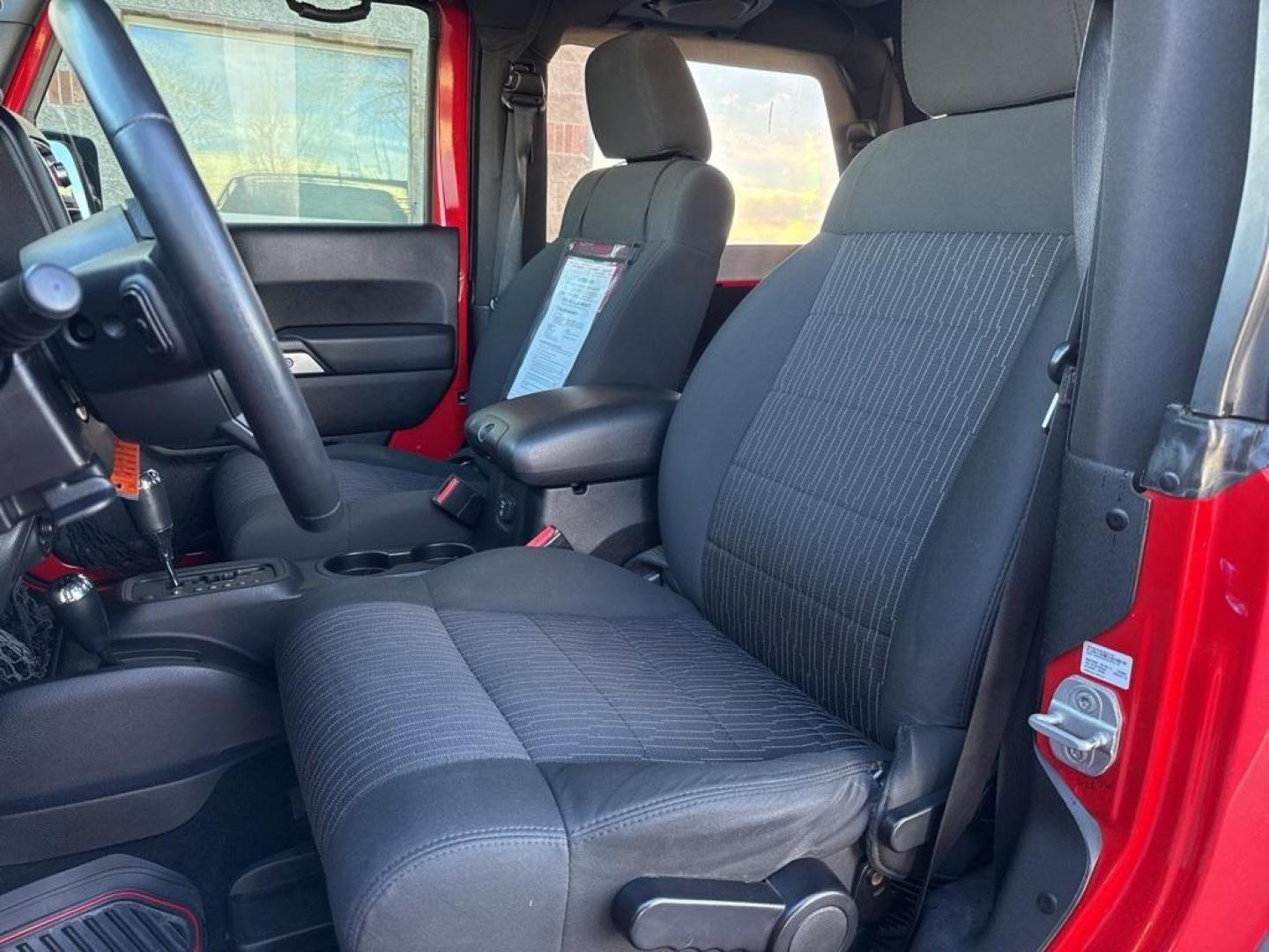 2011 Flame Red Clearcoat /Black Interior Jeep Wrangler Rubicon (1J4BA6D11BL) with an 3.8L V6 SMPI engine, Automatic transmission, located at 8595 Washington St., Thornton, CO, 80229, (303) 287-5511, 39.852348, -104.978447 - 2011 Jeep Wrangler 4WD Rubicon, the decals have just been removed from the hood. This Jeep is in excellent condition inside and out. No accidents and does not appear to have any off road use. Lots of extras on this Rubicon. Non smoker, Non pet car and really well maintained. <br><br> All Cars Have C - Photo#14