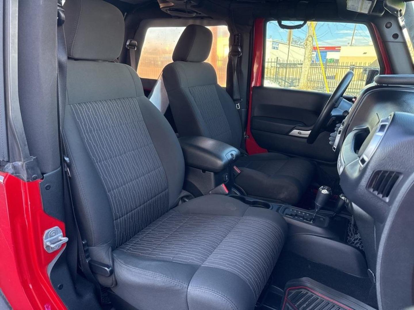 2011 Flame Red Clearcoat /Black Interior Jeep Wrangler Rubicon (1J4BA6D11BL) with an 3.8L V6 SMPI engine, Automatic transmission, located at 8595 Washington St., Thornton, CO, 80229, (303) 287-5511, 39.852348, -104.978447 - 2011 Jeep Wrangler 4WD Rubicon, the decals have just been removed from the hood. This Jeep is in excellent condition inside and out. No accidents and does not appear to have any off road use. Lots of extras on this Rubicon. Non smoker, Non pet car and really well maintained. <br><br> All Cars Have C - Photo#15