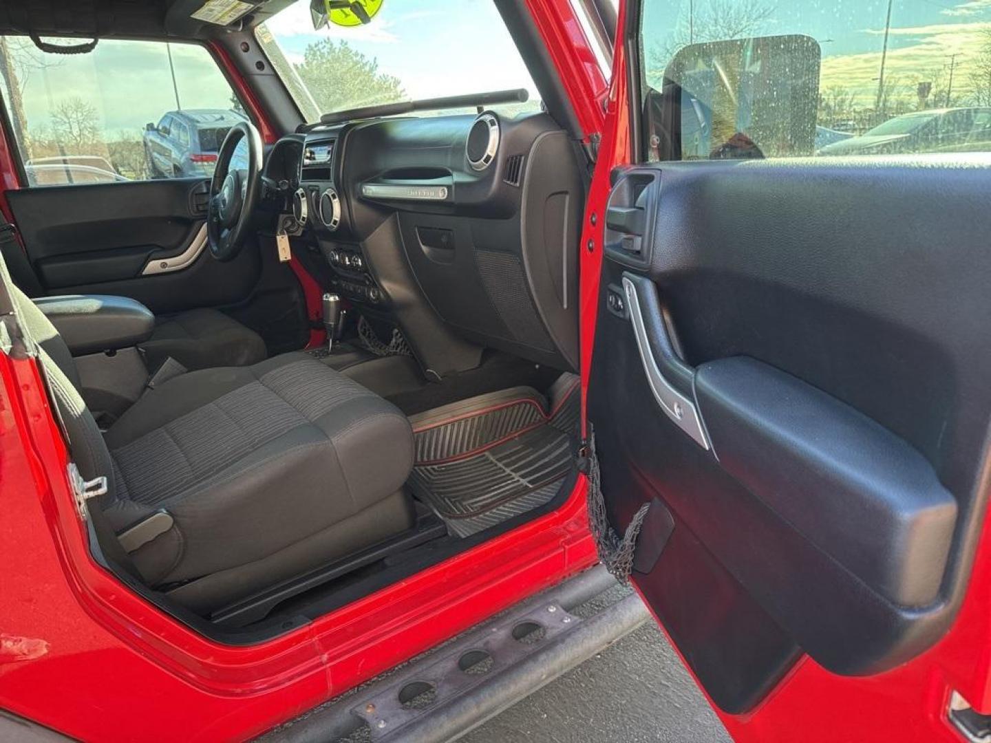 2011 Flame Red Clearcoat /Black Interior Jeep Wrangler Rubicon (1J4BA6D11BL) with an 3.8L V6 SMPI engine, Automatic transmission, located at 8595 Washington St., Thornton, CO, 80229, (303) 287-5511, 39.852348, -104.978447 - 2011 Jeep Wrangler 4WD Rubicon, the decals have just been removed from the hood. This Jeep is in excellent condition inside and out. No accidents and does not appear to have any off road use. Lots of extras on this Rubicon. Non smoker, Non pet car and really well maintained. <br><br> All Cars Have C - Photo#20