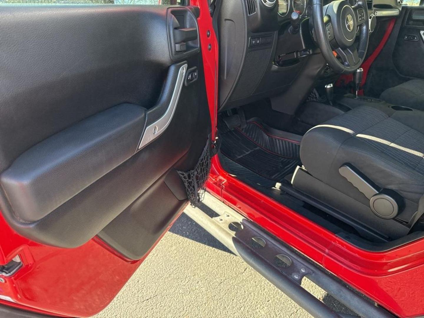 2011 Flame Red Clearcoat /Black Interior Jeep Wrangler Rubicon (1J4BA6D11BL) with an 3.8L V6 SMPI engine, Automatic transmission, located at 8595 Washington St., Thornton, CO, 80229, (303) 287-5511, 39.852348, -104.978447 - 2011 Jeep Wrangler 4WD Rubicon, the decals have just been removed from the hood. This Jeep is in excellent condition inside and out. No accidents and does not appear to have any off road use. Lots of extras on this Rubicon. Non smoker, Non pet car and really well maintained. <br><br> All Cars Have C - Photo#22