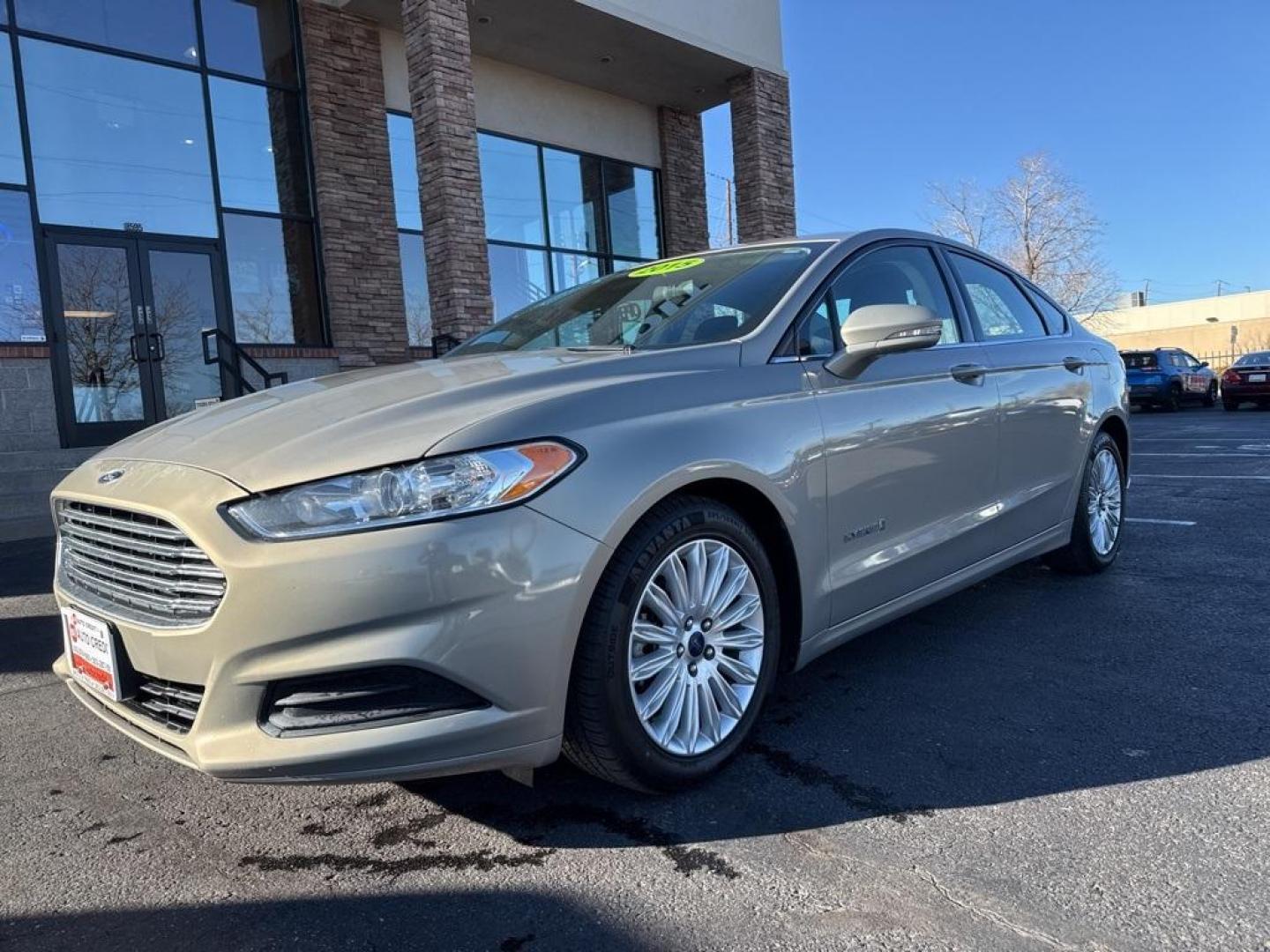 2015 Tectonic /Charcoal Black Ford Fusion Hybrid SE (3FA6P0LU4FR) with an I4 Hybrid engine, CVT transmission, located at 8595 Washington St., Thornton, CO, 80229, (303) 287-5511, 39.852348, -104.978447 - 2015 Ford Fusion Hybrid FWD I4 Hybrid.<br><br>D1 Auto NEVER charges dealer fees! All cars have clean titles and have been inspected for mechanical issues. We have financing for everyone. Good credit, bad credit, first time buyers.<br><br>Please call Lakewood Location 303-274-7692 or Thornton 303-287 - Photo#0